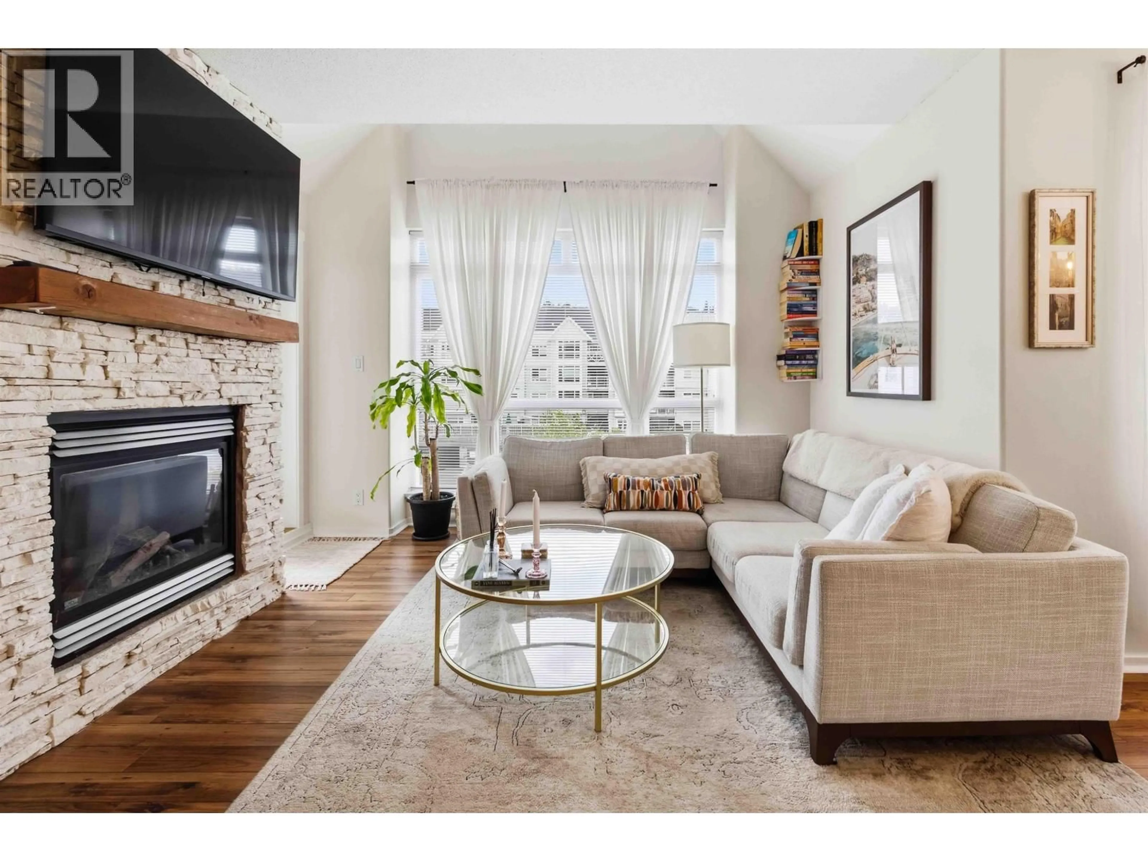 Living room with furniture, wood/laminate floor for 401 - 3142 ST JOHNS STREET, Port Moody British Columbia V3H5E5