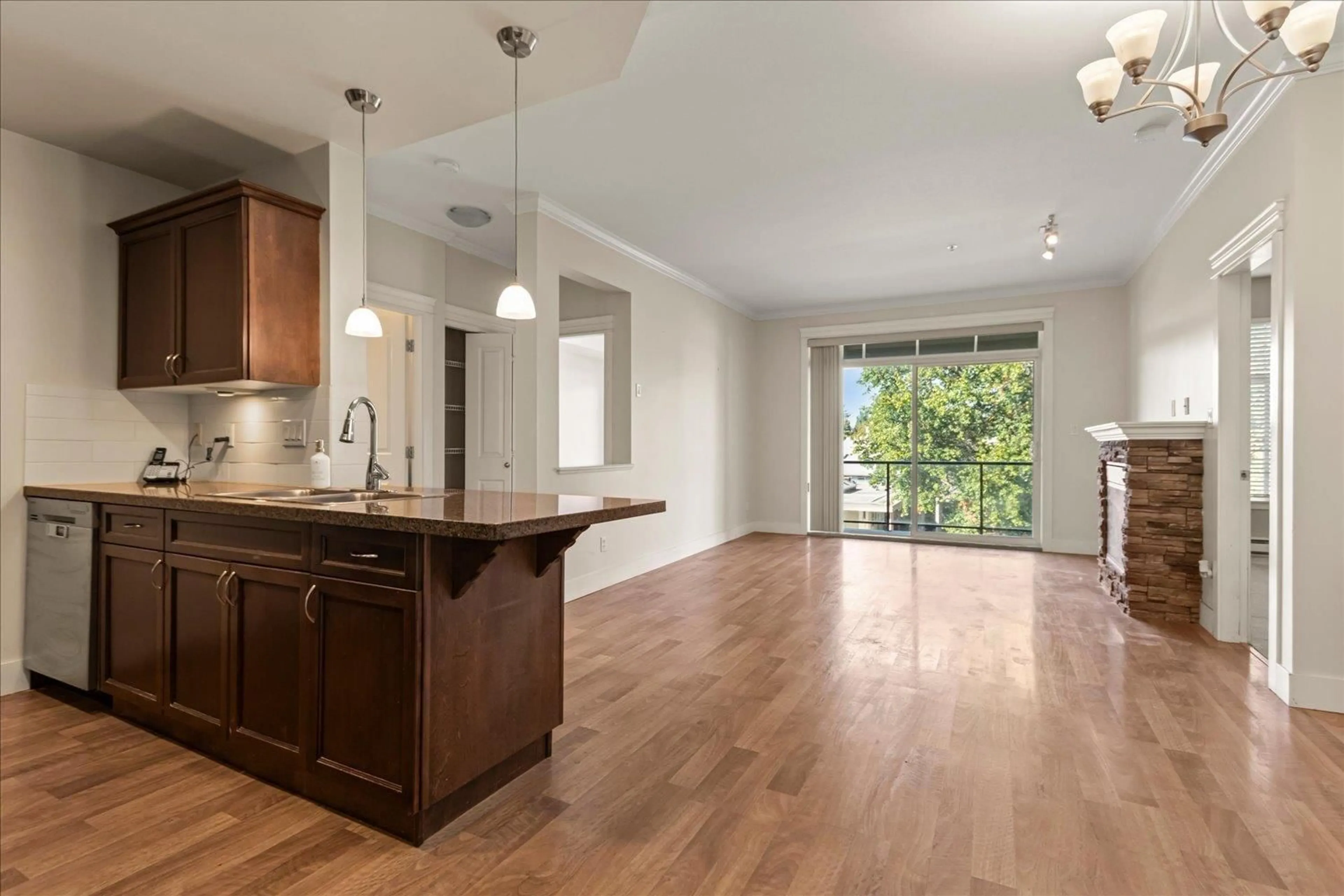 Open concept kitchen, wood/laminate floor for 302 - 33338 MAYFAIR AVENUE, Abbotsford British Columbia V2S0A4