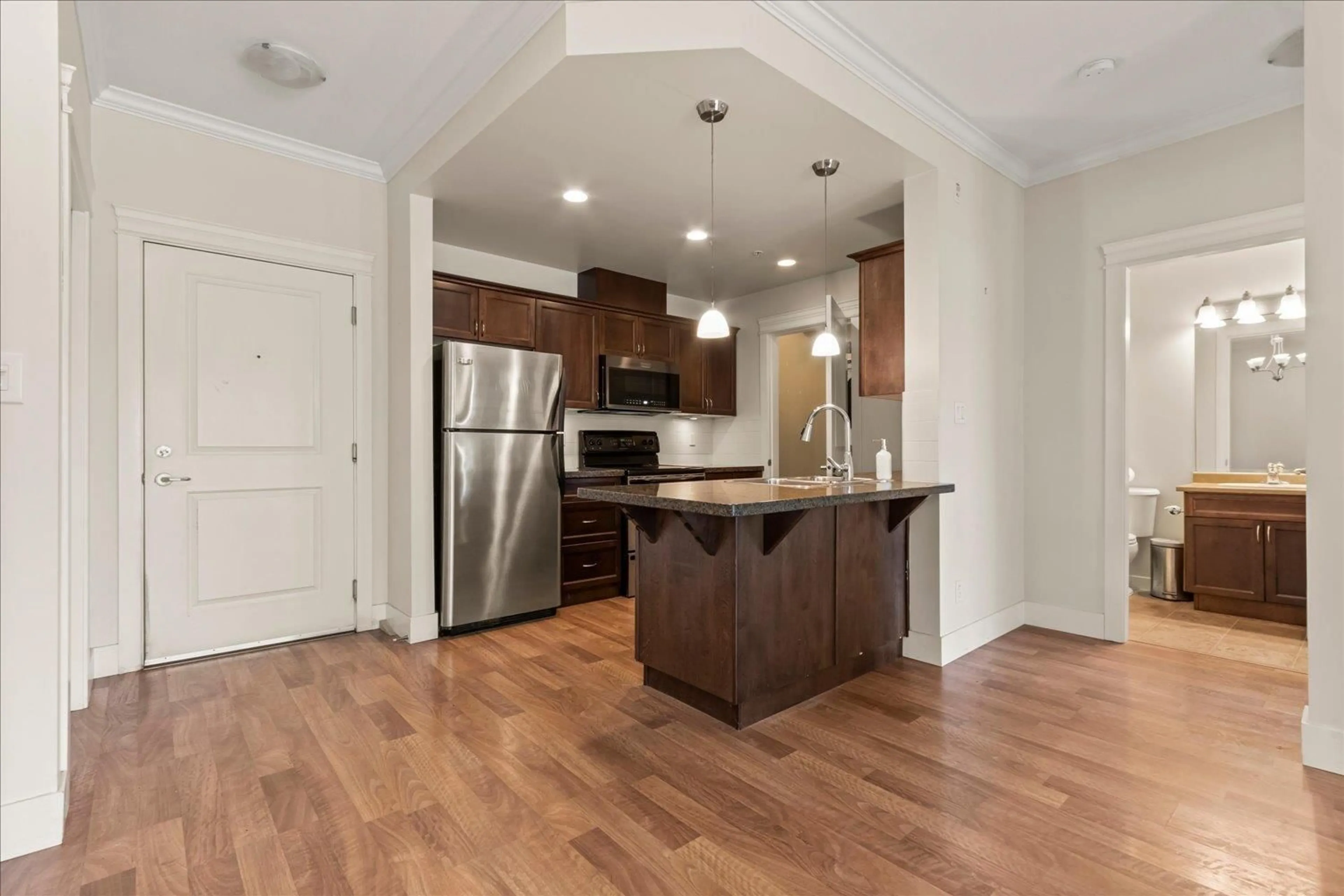 Open concept kitchen, wood/laminate floor for 302 - 33338 MAYFAIR AVENUE, Abbotsford British Columbia V2S0A4