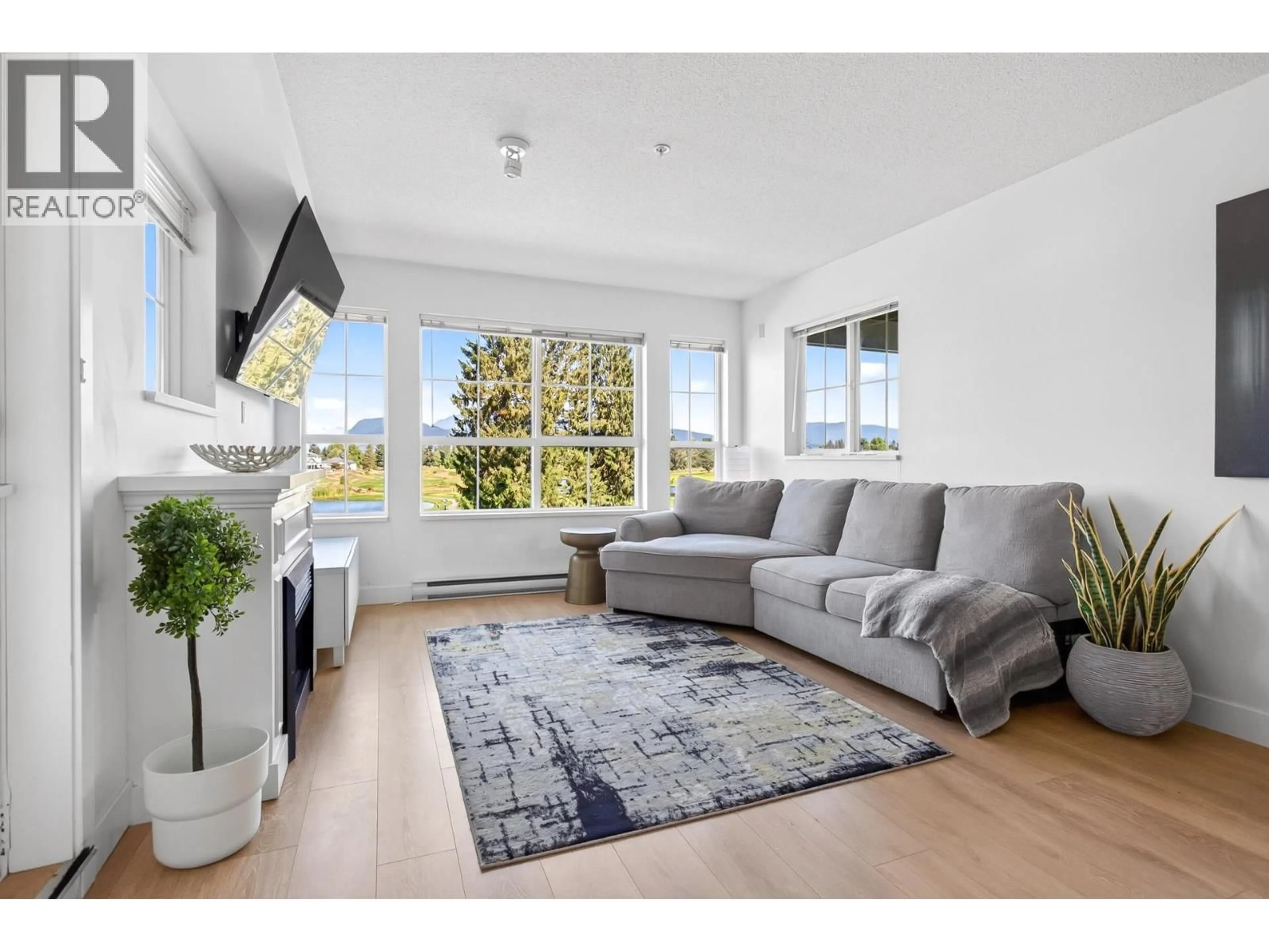 Living room with furniture, unknown for 227 - 19673 MEADOW GARDENS WAY, Pitt Meadows British Columbia V3Y0A1