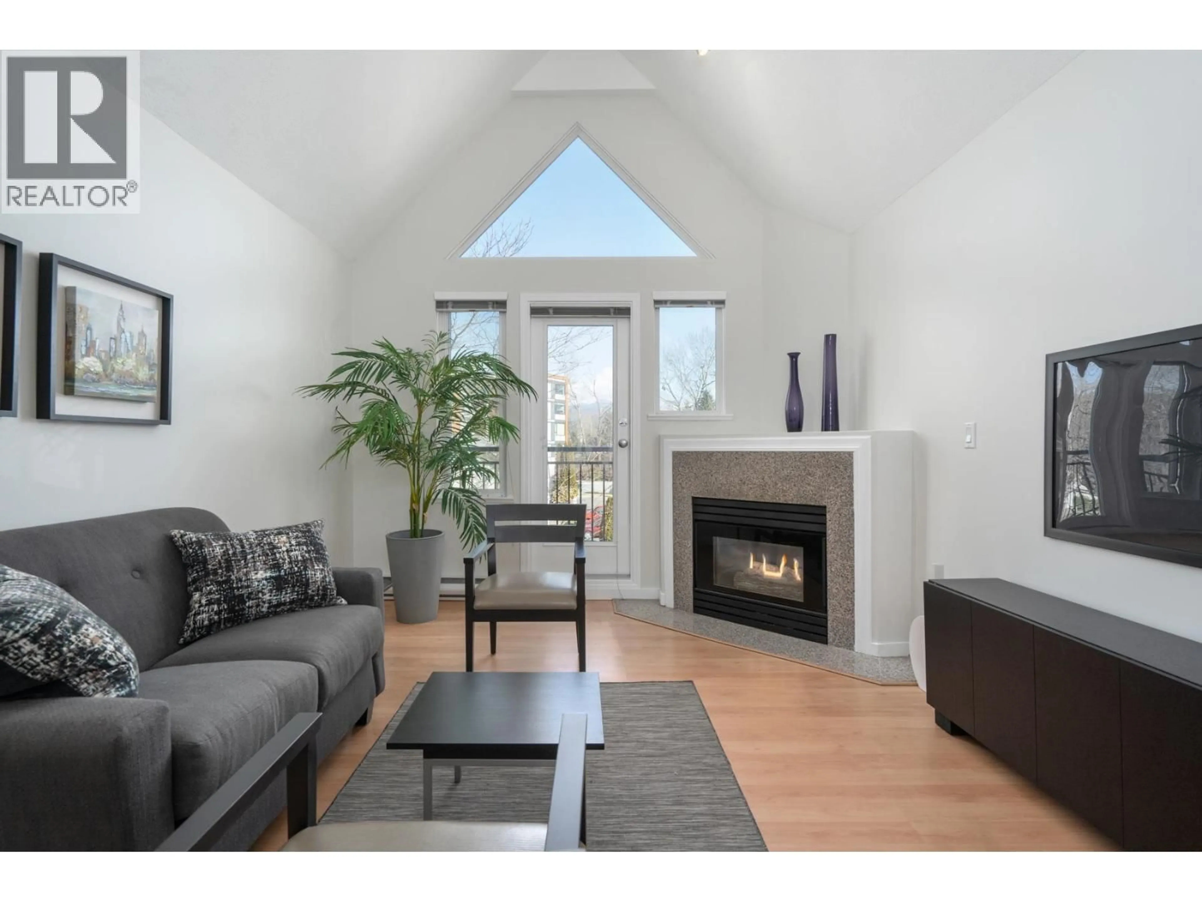 Living room with furniture, wood/laminate floor for 301 - 1928 11TH AVENUE, Vancouver British Columbia V5N1Z2