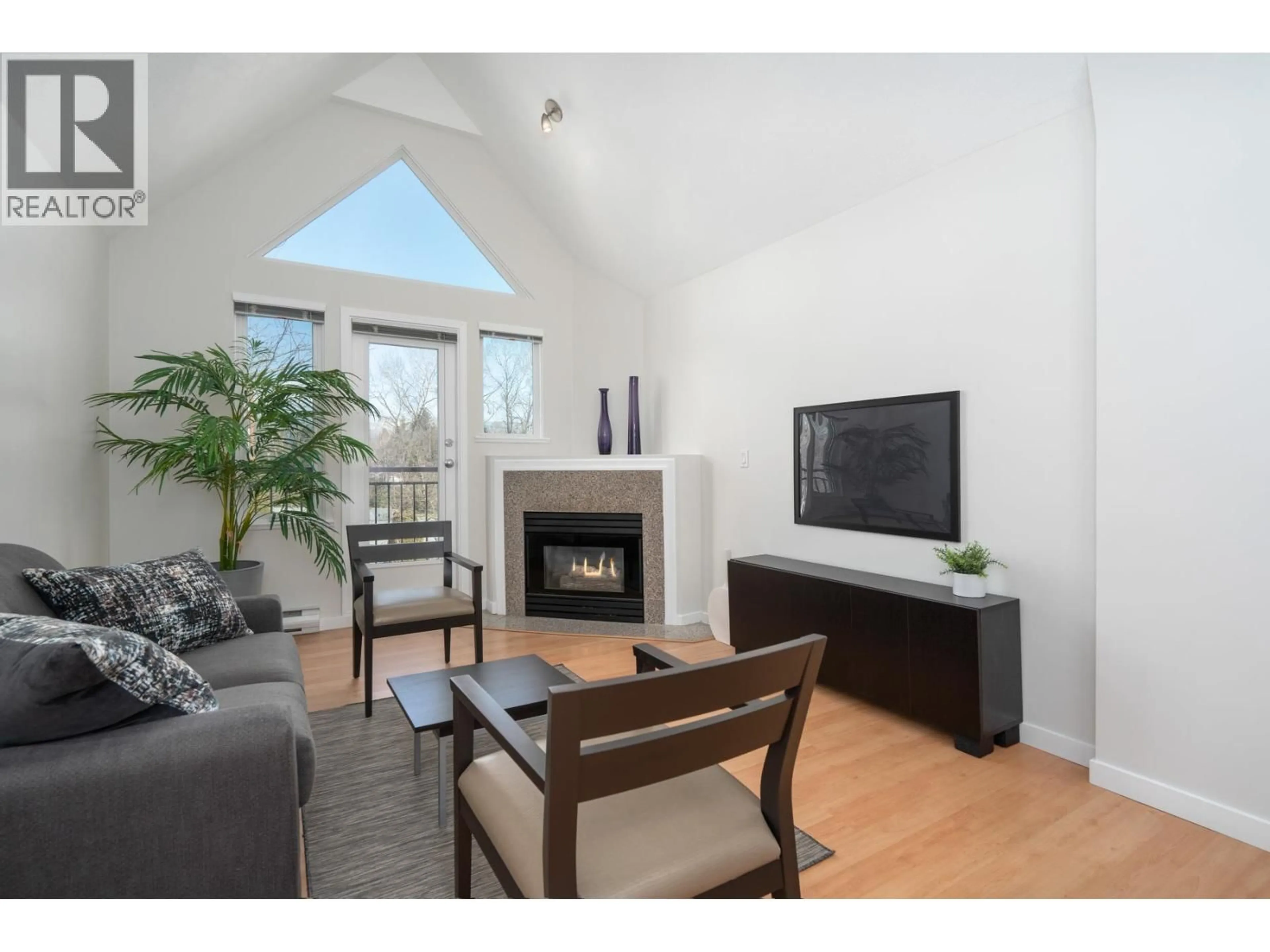 Living room with furniture, wood/laminate floor for 301 - 1928 11TH AVENUE, Vancouver British Columbia V5N1Z2