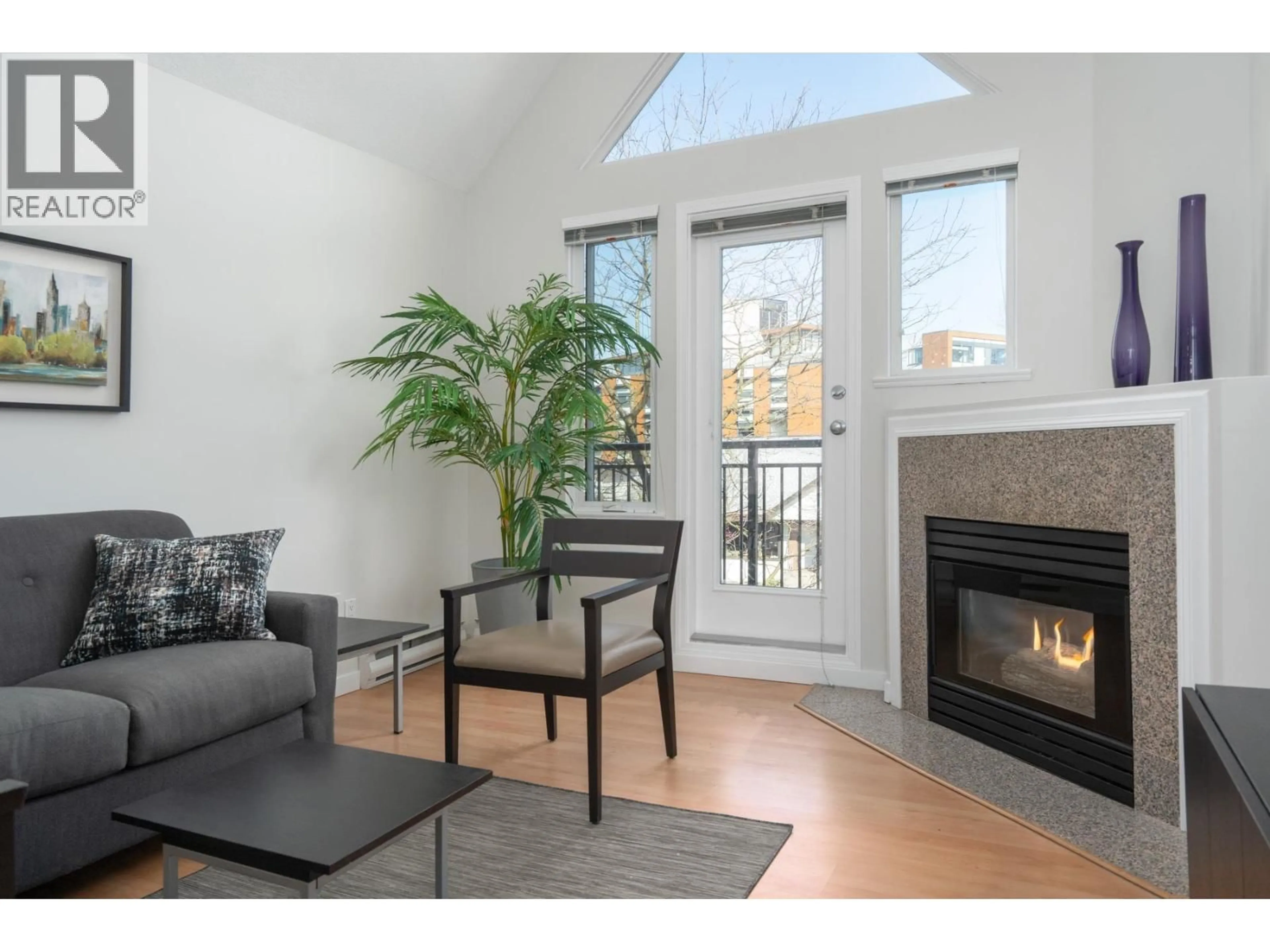 Living room with furniture, wood/laminate floor for 301 - 1928 11TH AVENUE, Vancouver British Columbia V5N1Z2