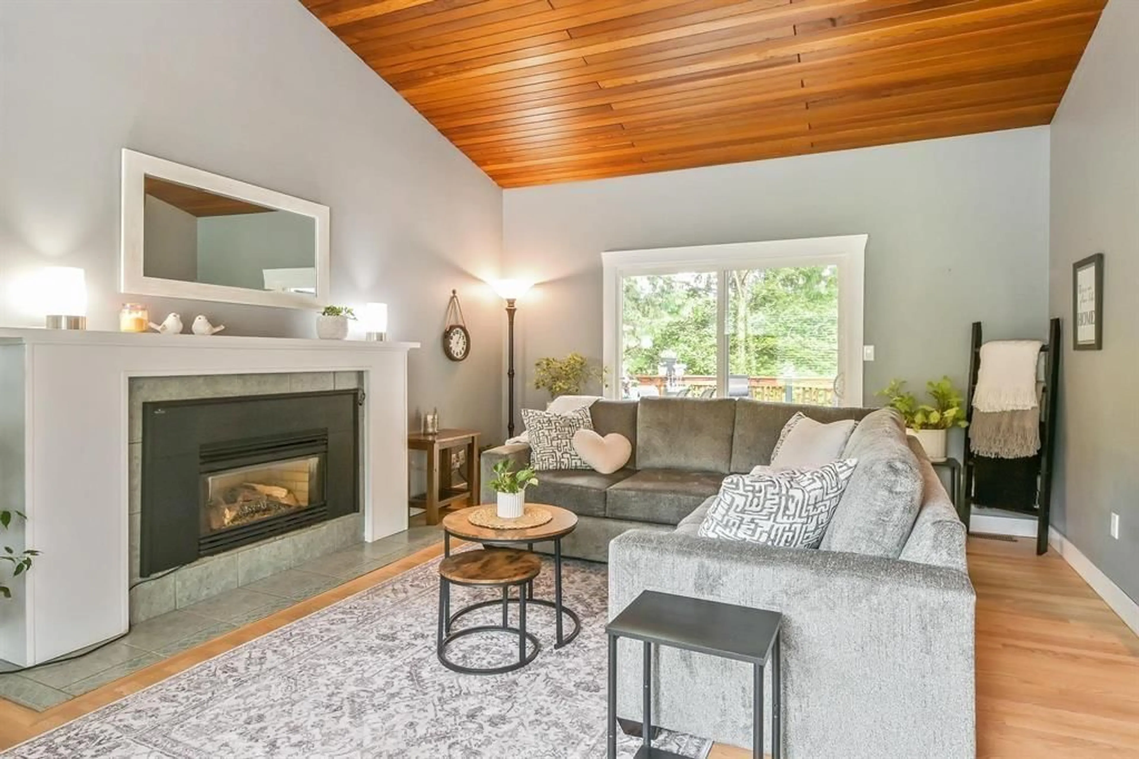 Living room with furniture, wood/laminate floor for 23913 58A AVENUE, Langley British Columbia V2Z1A5