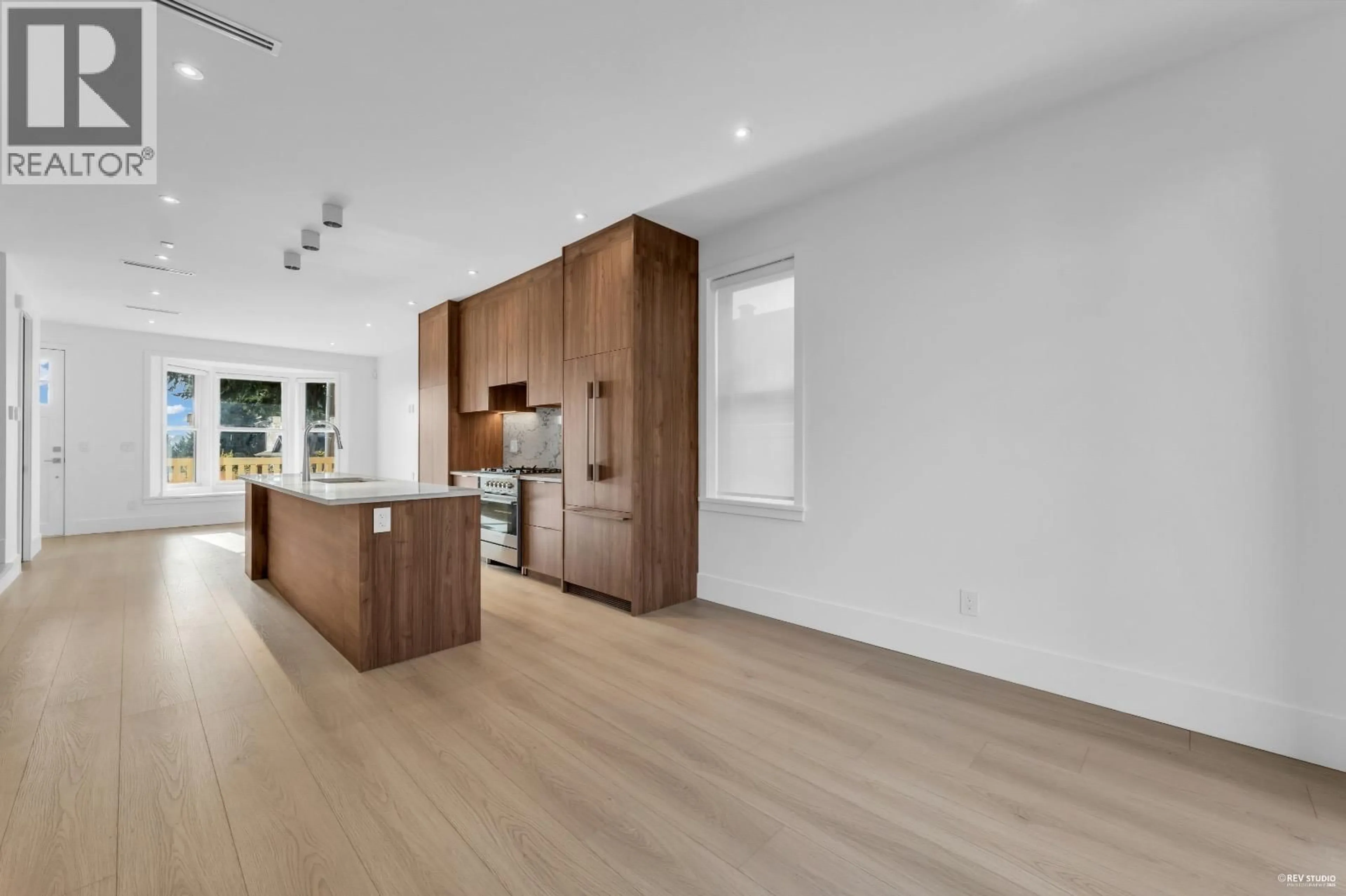 Open concept kitchen, wood/laminate floor for 102 - 1125 CARTIER AVENUE, Coquitlam British Columbia V3K2C1