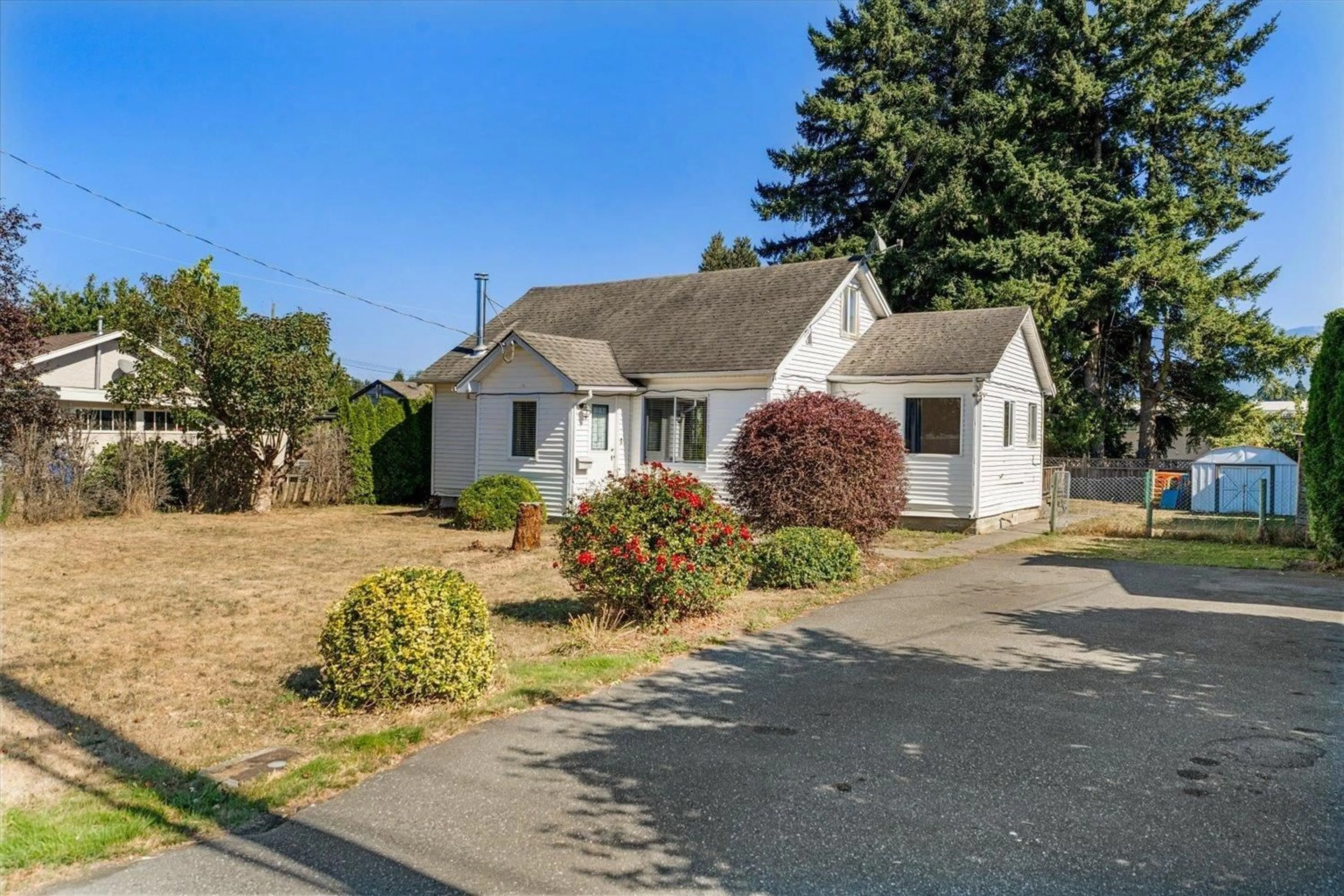 A pic from outside/outdoor area/front of a property/back of a property/a pic from drone, street for 9260 MCNAUGHT ROAD, Chilliwack British Columbia V2P6E6
