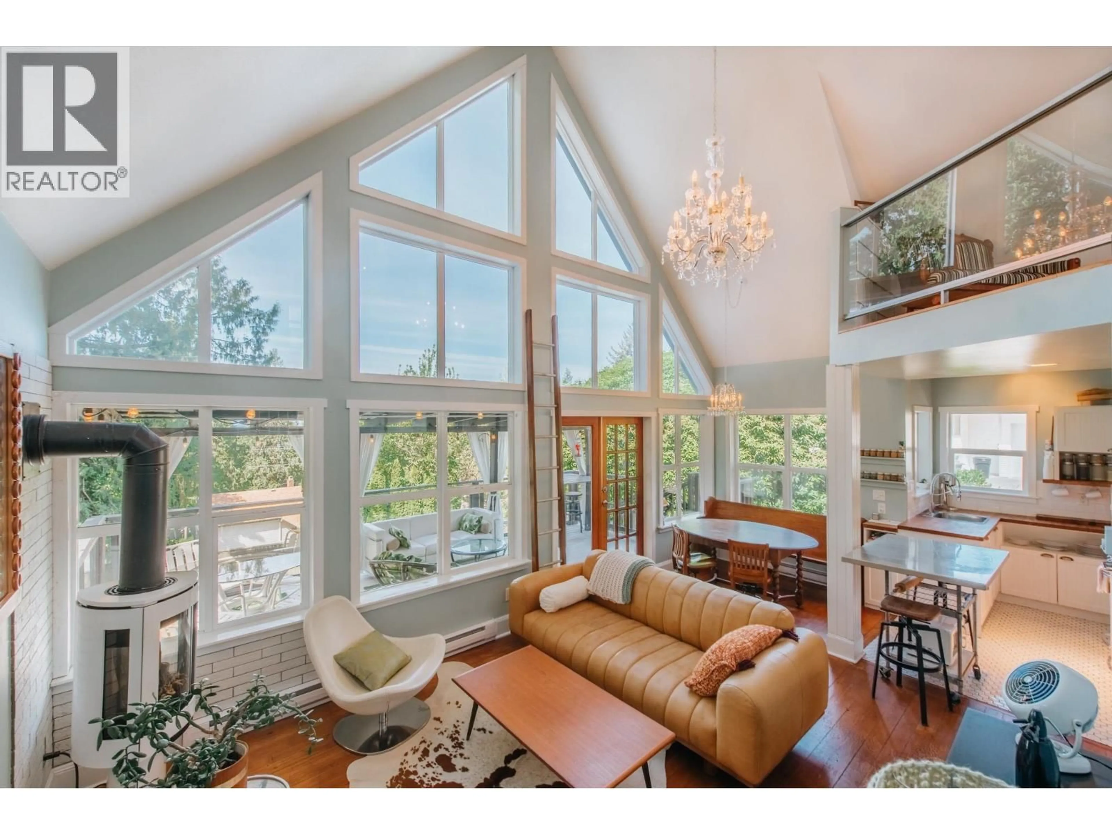 Living room with furniture, wood/laminate floor for 4981 GEER ROAD, Sechelt British Columbia V7Z0B9