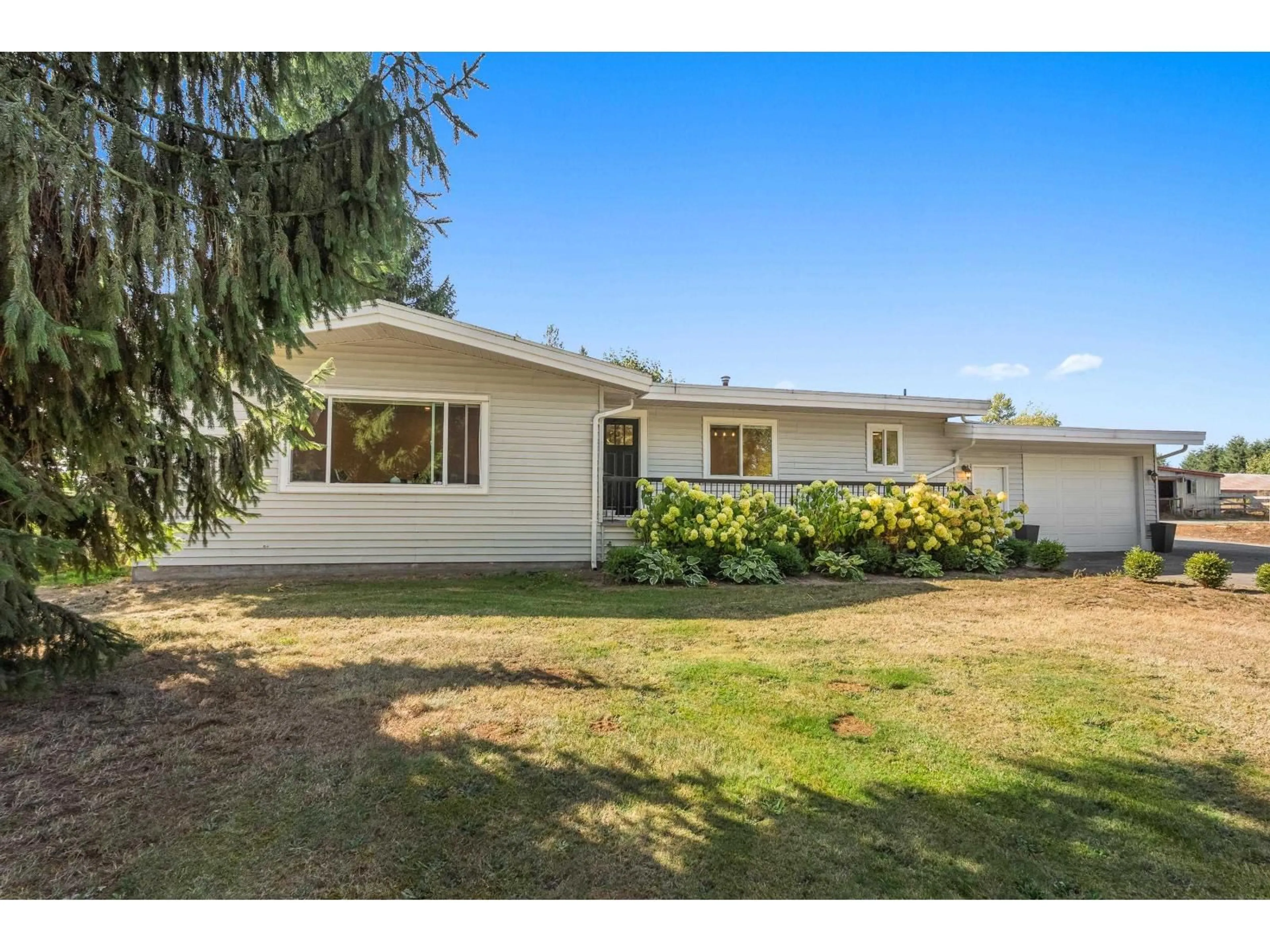 A pic from outside/outdoor area/front of a property/back of a property/a pic from drone, street for 2481 LEFEUVRE ROAD, Abbotsford British Columbia V4X1E3