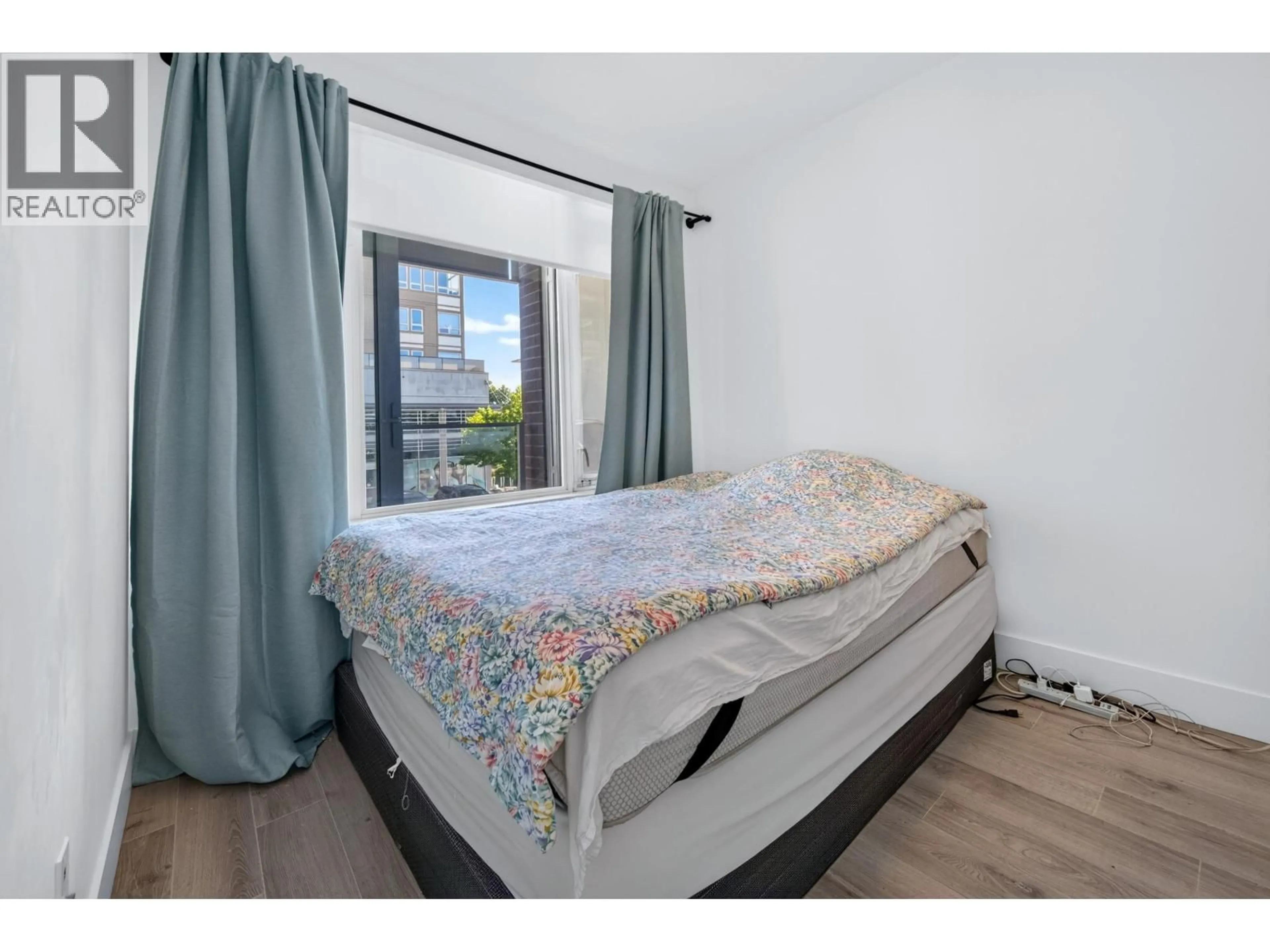 Bedroom with bed, unknown for 208 - 10780 NO. 5 ROAD, Richmond British Columbia V6W0B8