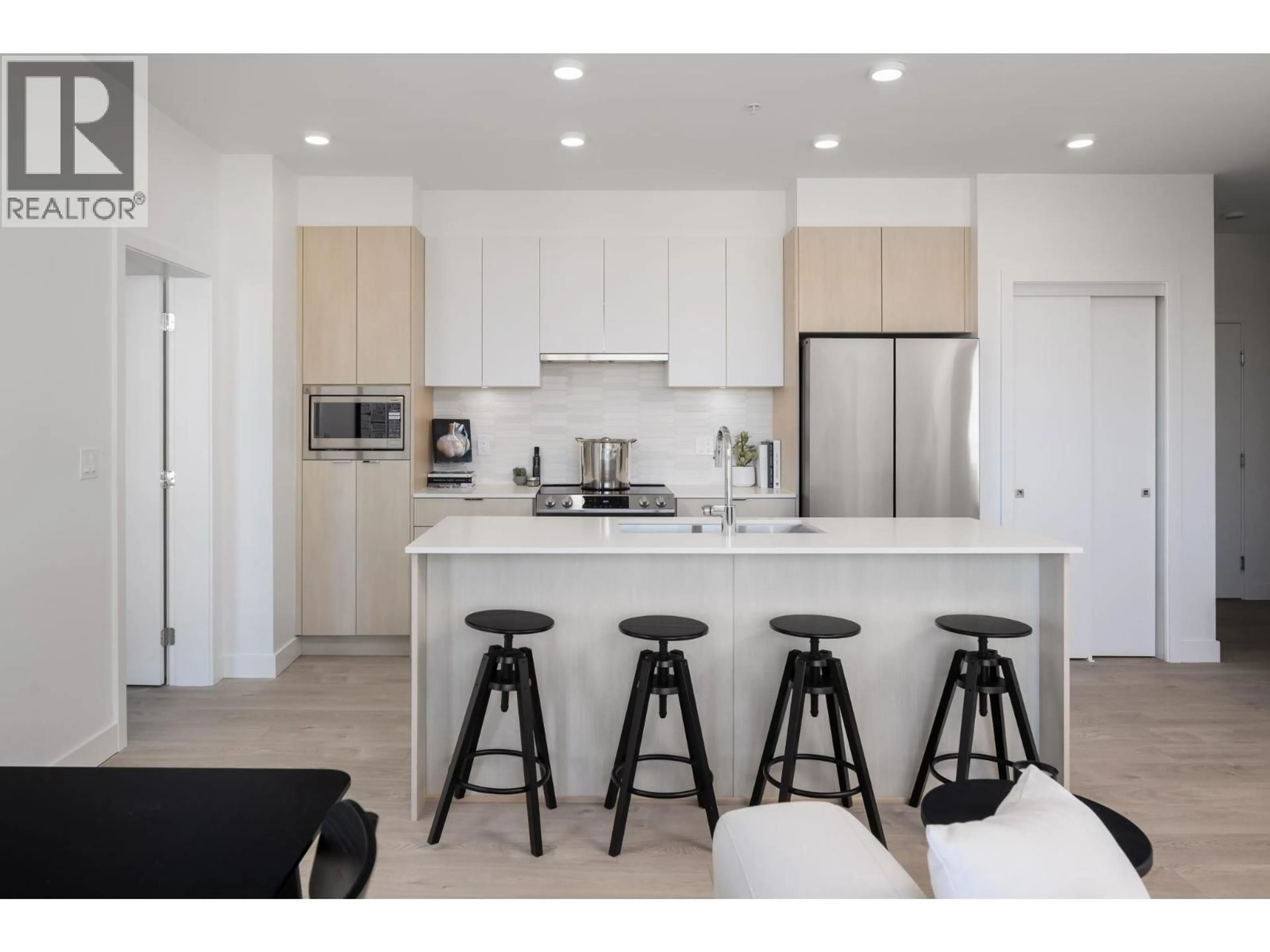 Open concept kitchen, wood/laminate floor for 419 - 2463 RABBIT DRIVE, Tsawwassen British Columbia V4M0G6