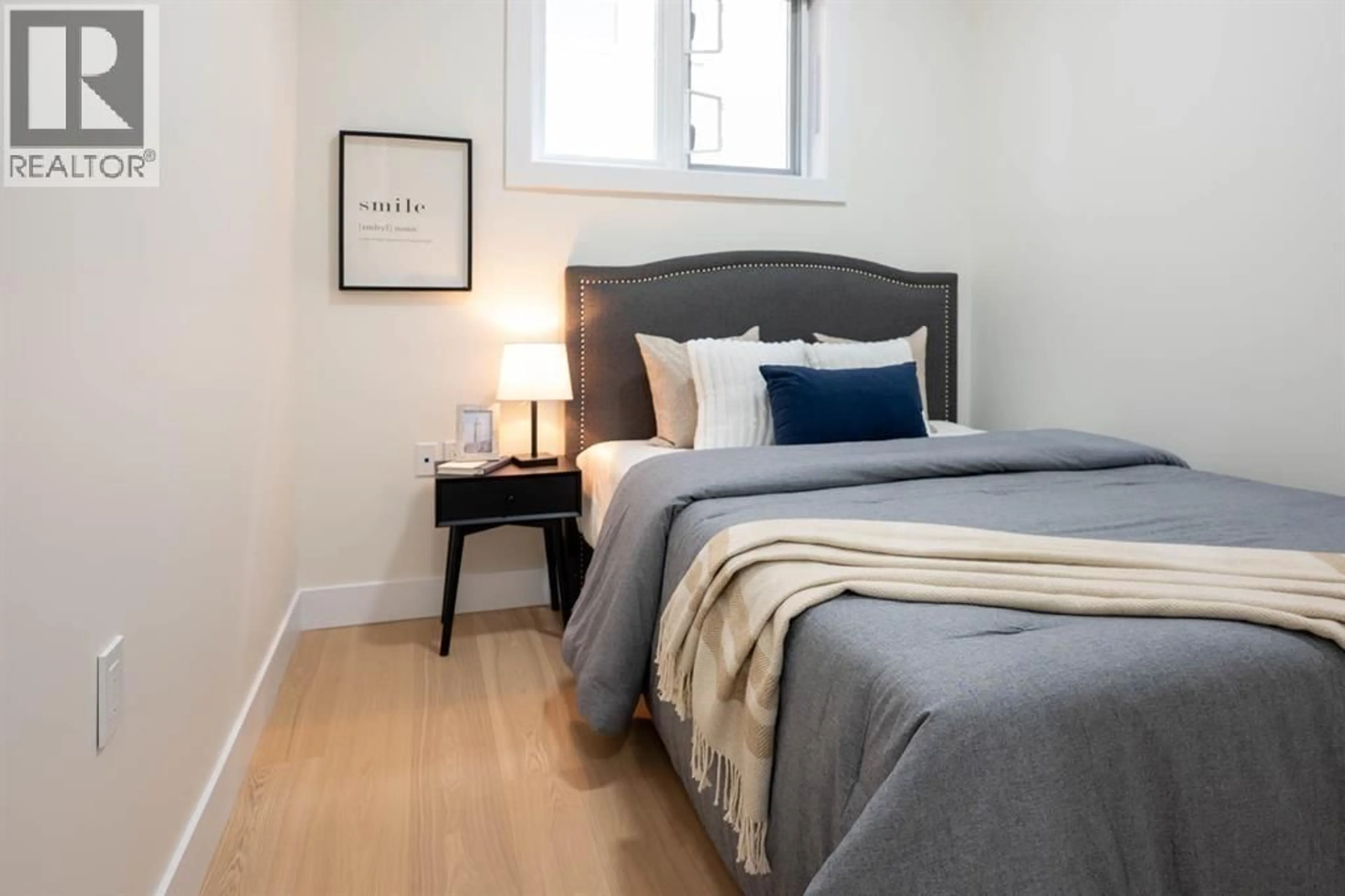 Bedroom with bed, wood/laminate floor for 1 - 4874 LANARK STREET, Vancouver British Columbia V5N3S2