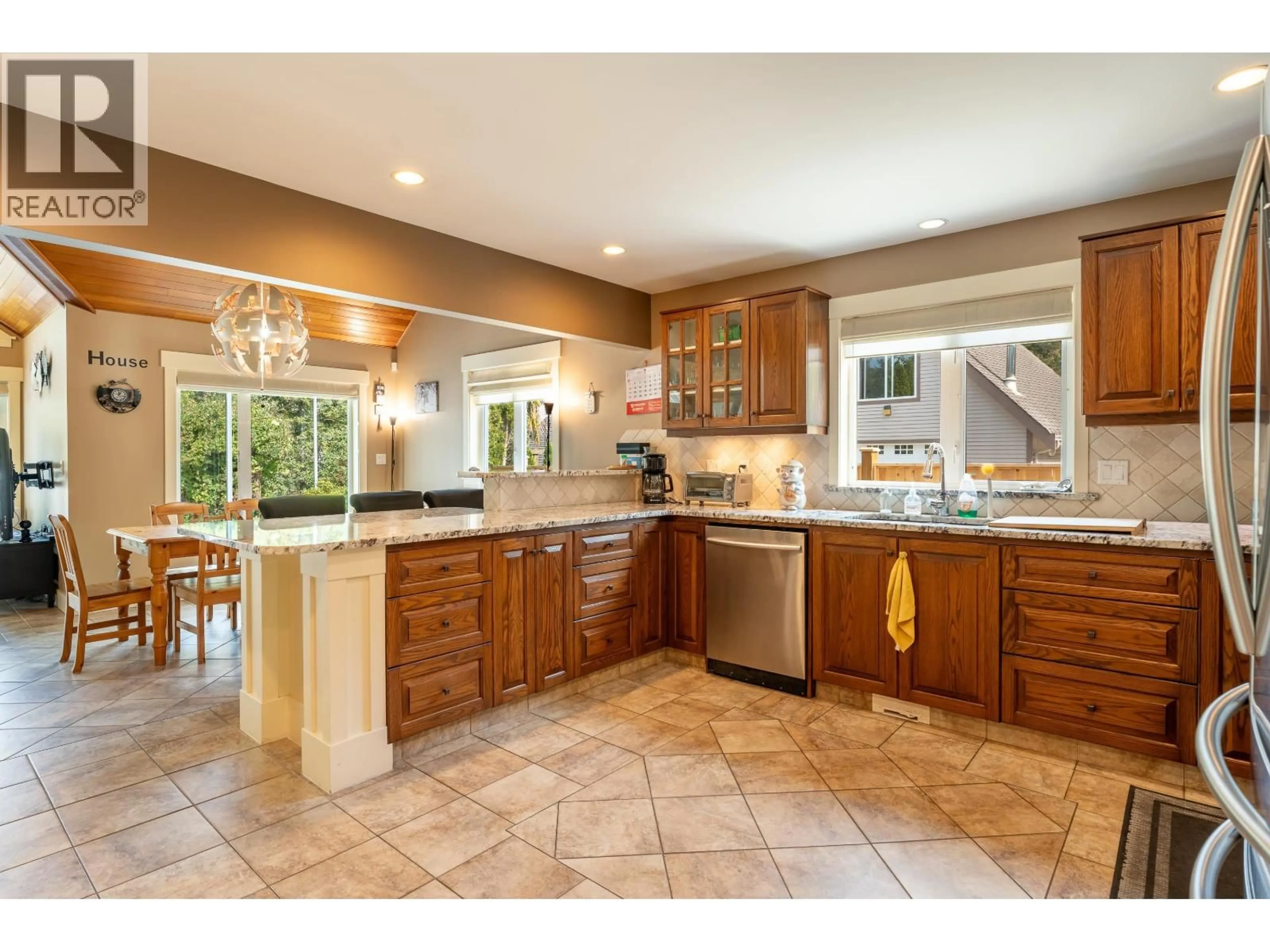 Open concept kitchen, ceramic/tile floor for 5393 SANS SOUCI ROAD, Halfmoon Bay British Columbia V7Z1B6