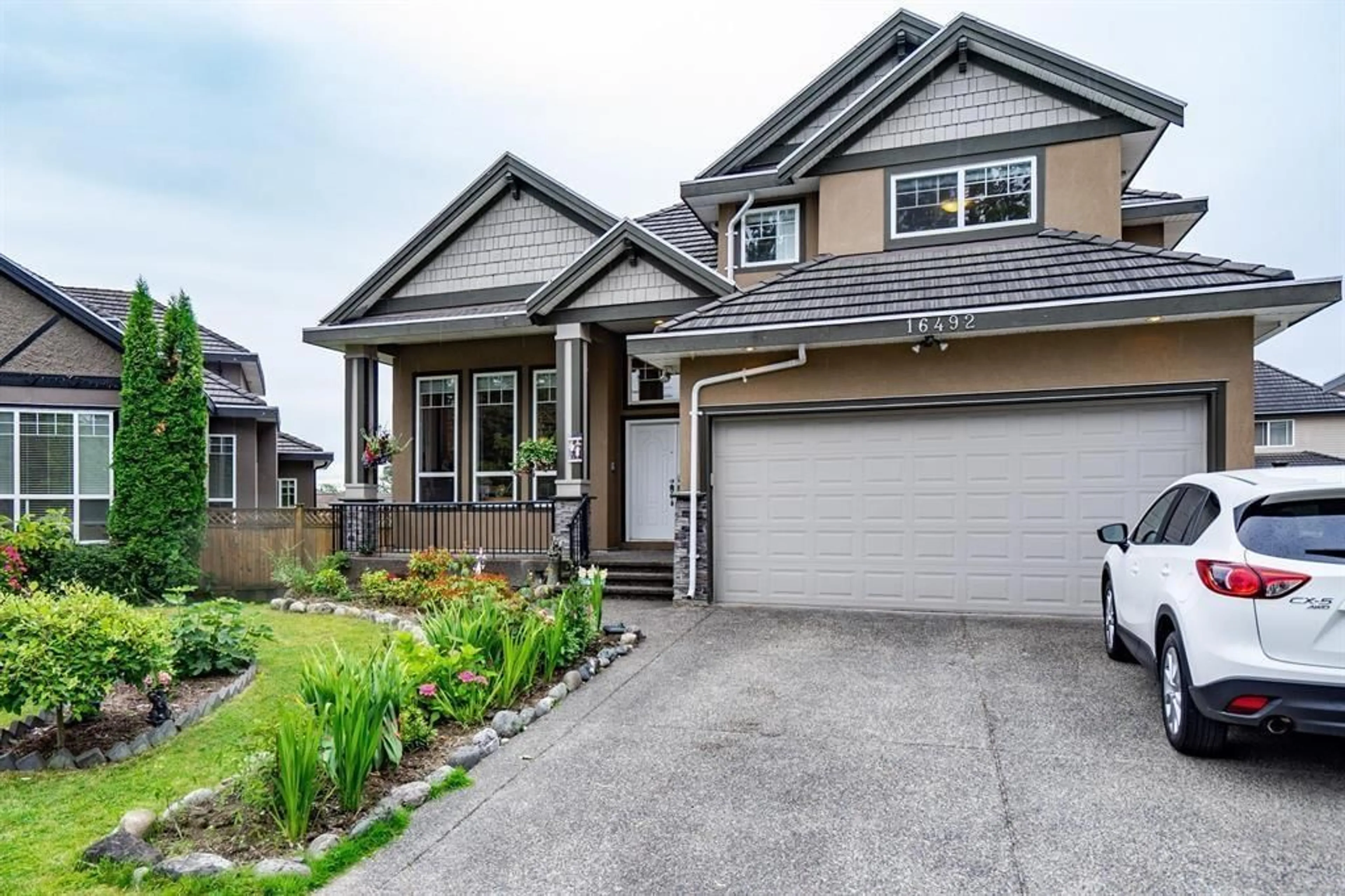 Home with vinyl exterior material, street for 16492 104A AVENUE, Surrey British Columbia V4N5S6