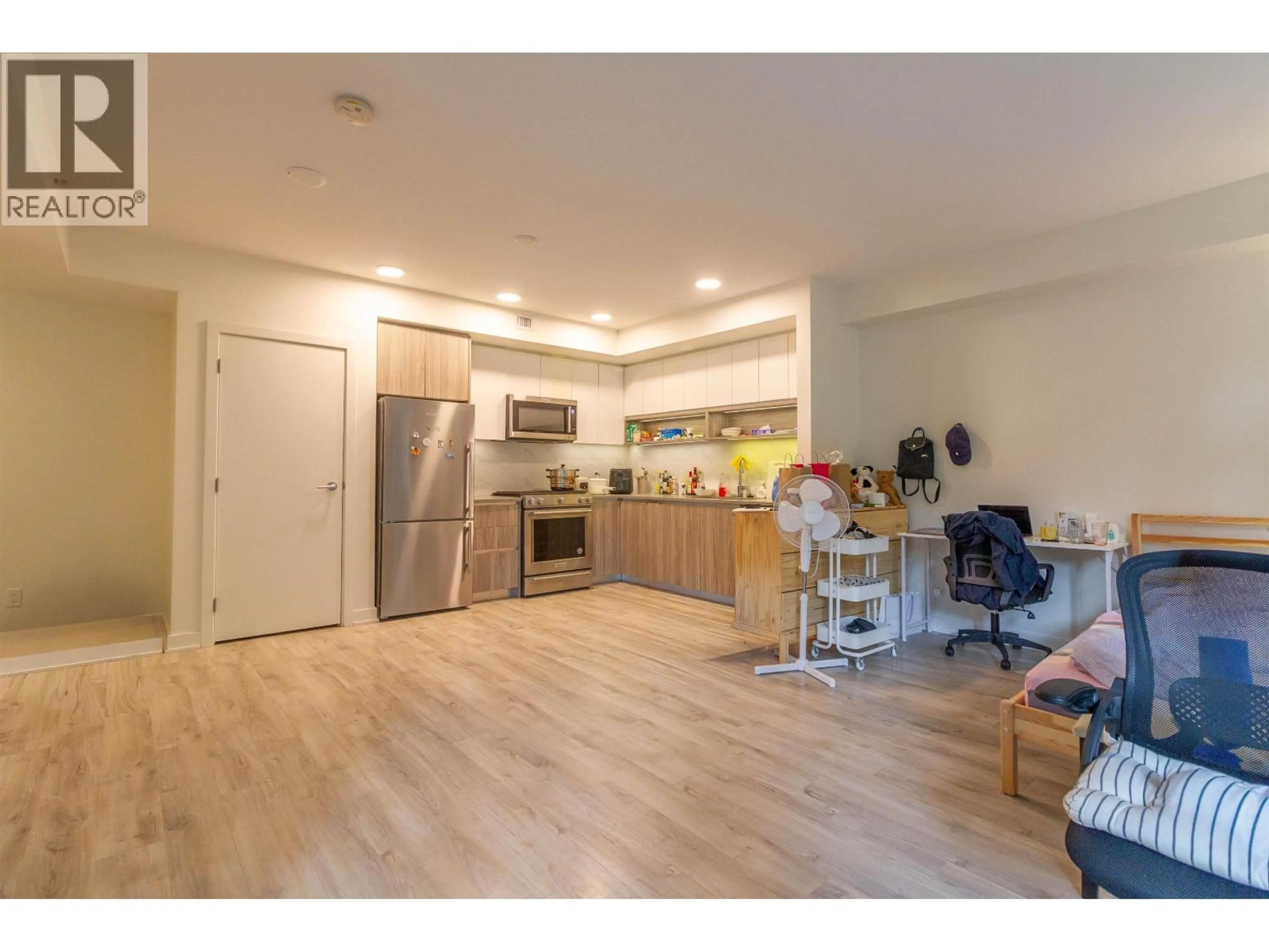 Open concept kitchen, wood/laminate floor for 201 - 8940 UNIVERSITY CRESCENT, Burnaby British Columbia V5A0E7