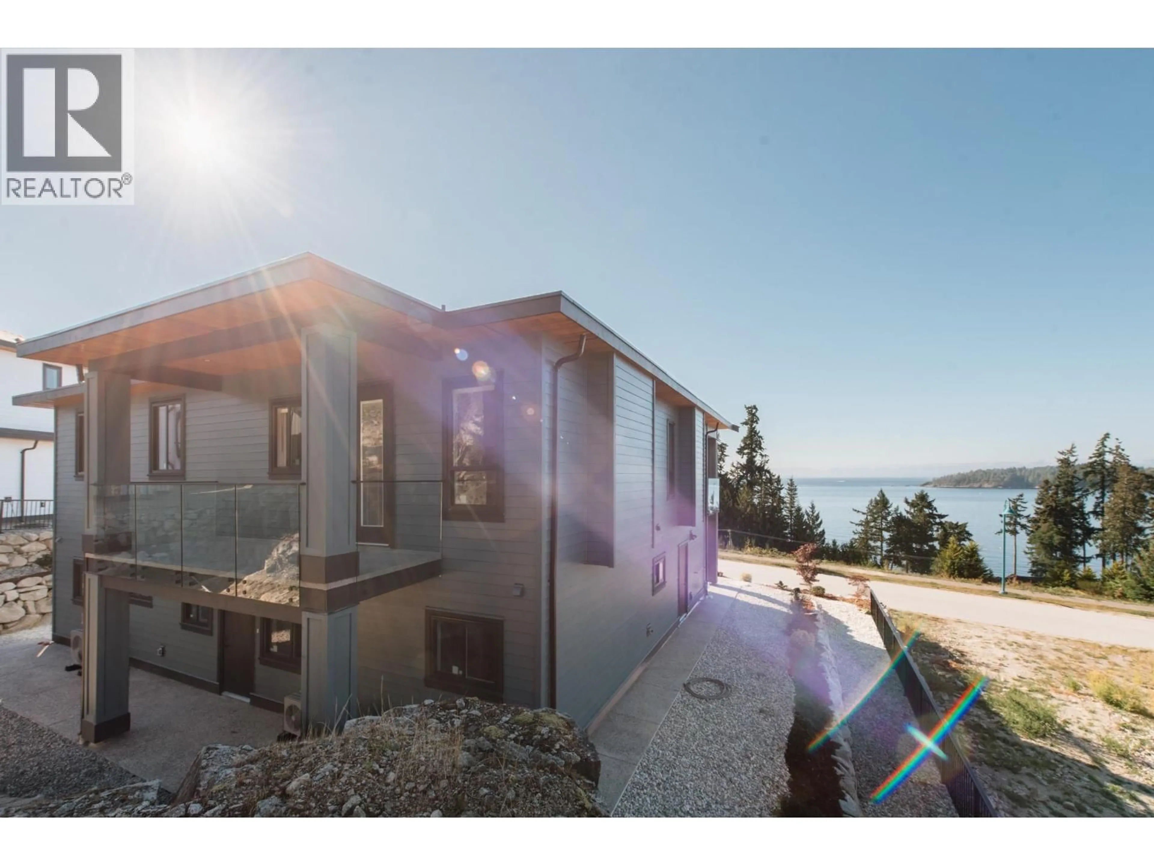 A pic from outside/outdoor area/front of a property/back of a property/a pic from drone, water/lake/river/ocean view for 5972/74 BARNACLE STREET, Sechelt British Columbia V7Z0V4