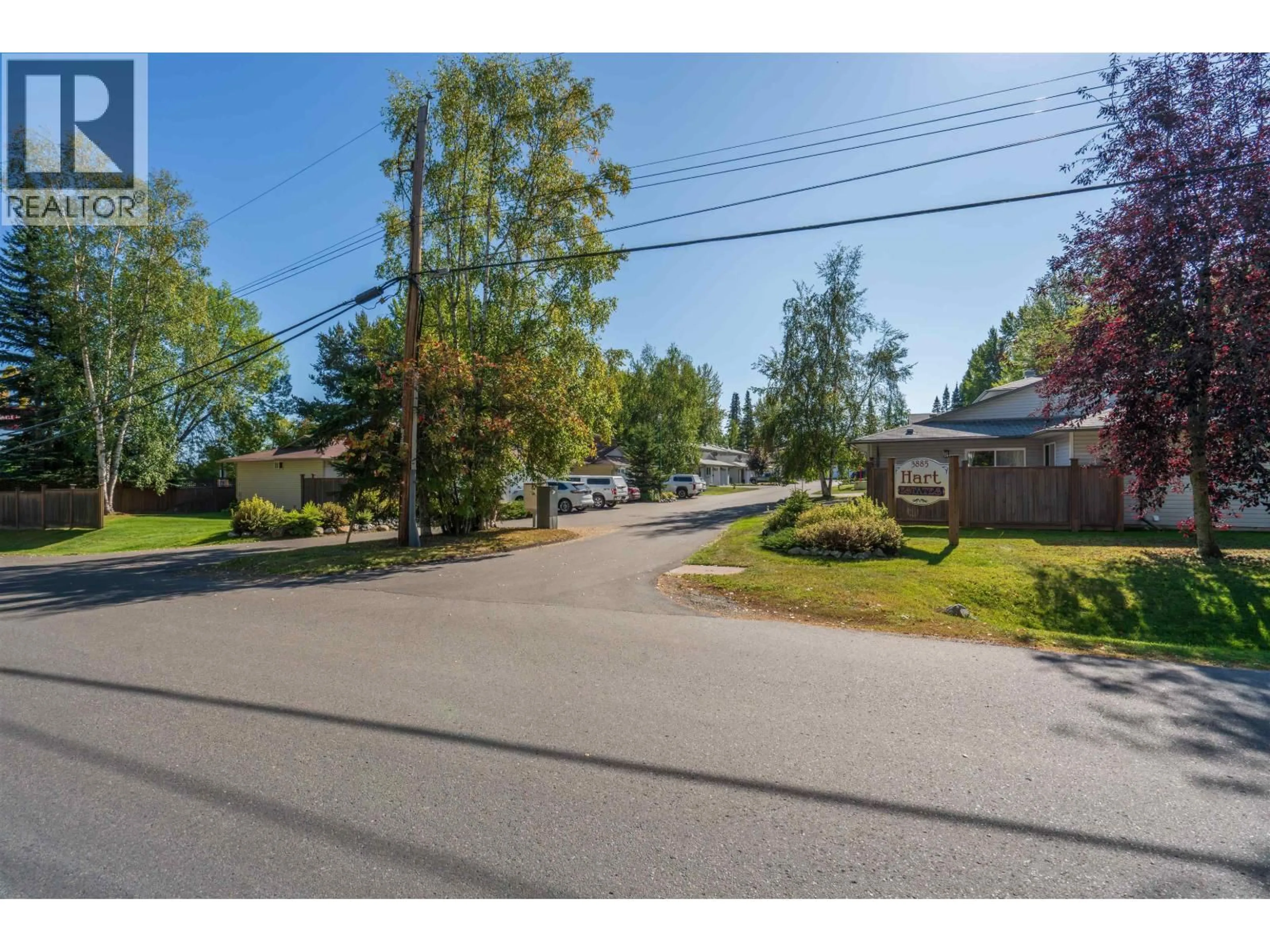 A pic from outside/outdoor area/front of a property/back of a property/a pic from drone, street for 114 - 3885 RICHET STREET, Prince George British Columbia V2K2J2
