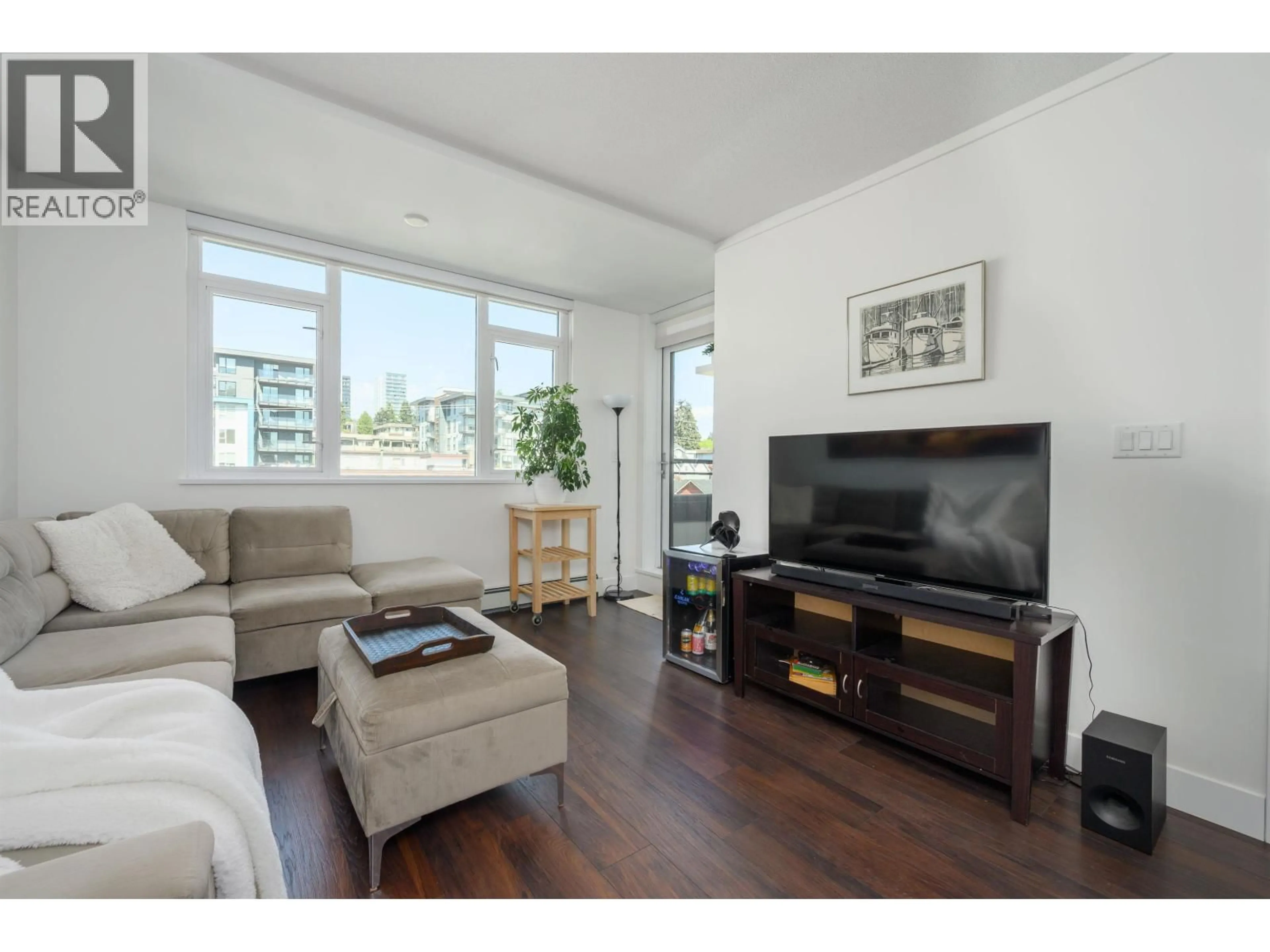 Living room with furniture, wood/laminate floor for 504 - 131 3RD STREET, North Vancouver British Columbia V7L0E3