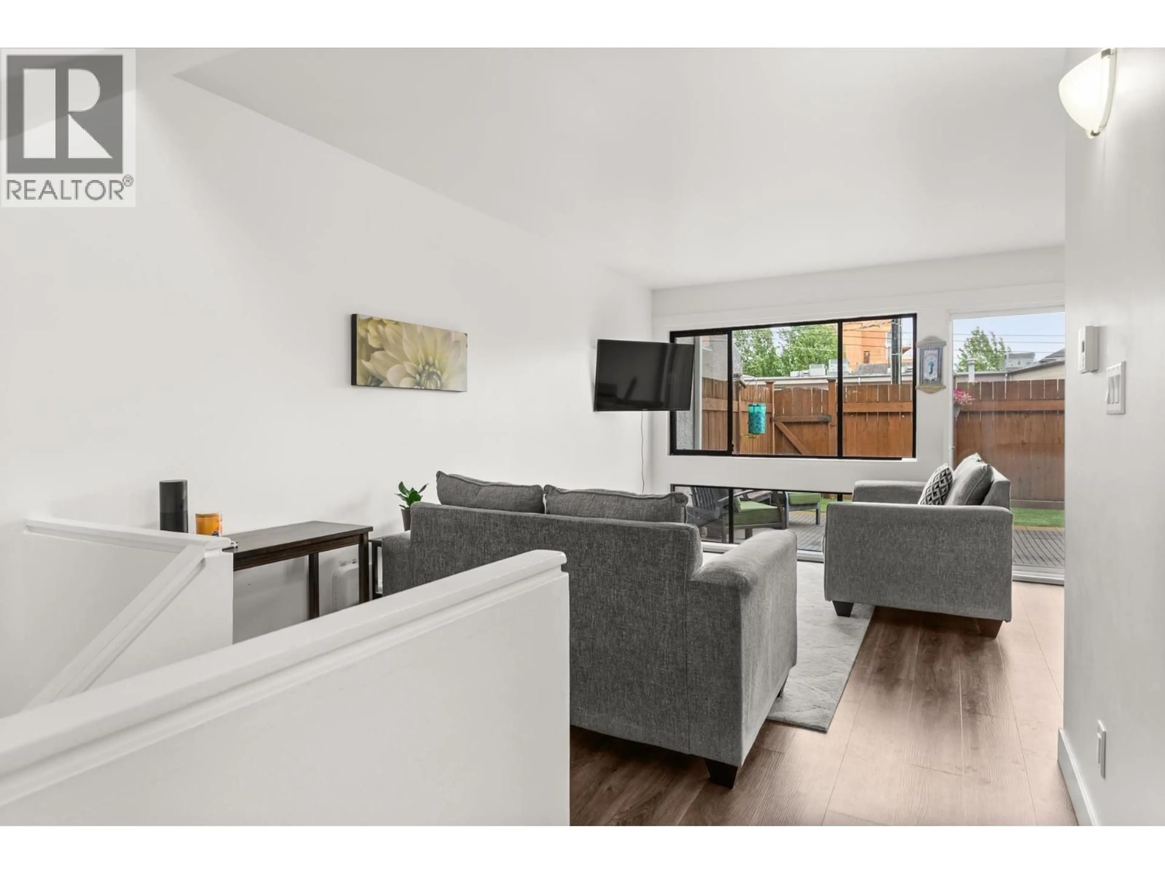 Living room with furniture, wood/laminate floor for 4816 TURNBUCKLE WYND, Delta British Columbia V4K4A6
