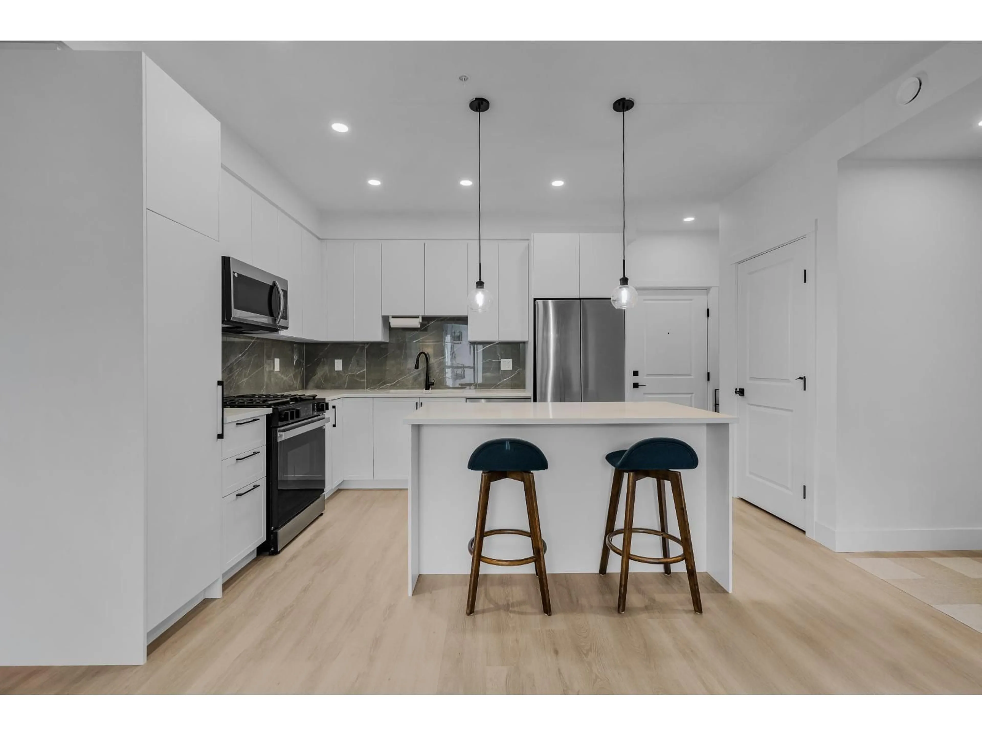 Open concept kitchen, unknown for 501 - 3438 146A STREET, Surrey British Columbia V4P0J1
