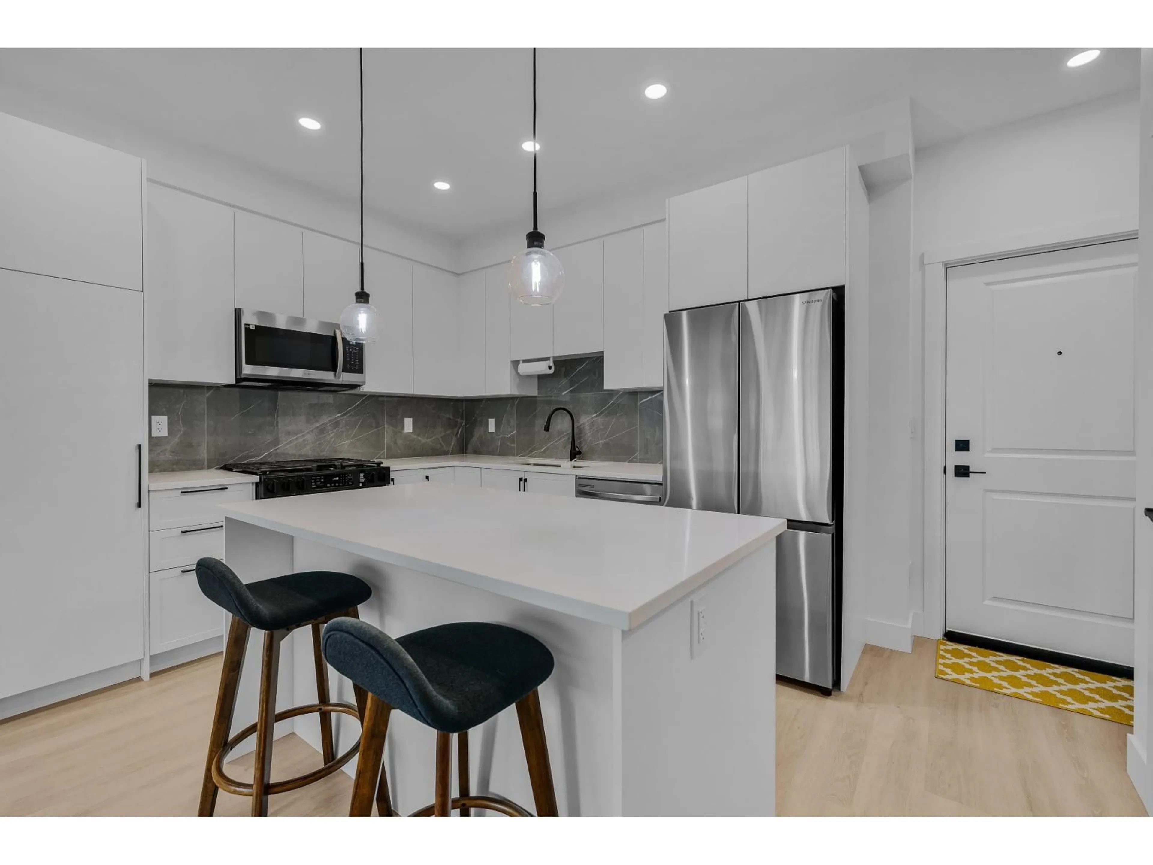 Open concept kitchen, unknown for 501 - 3438 146A STREET, Surrey British Columbia V4P0J1