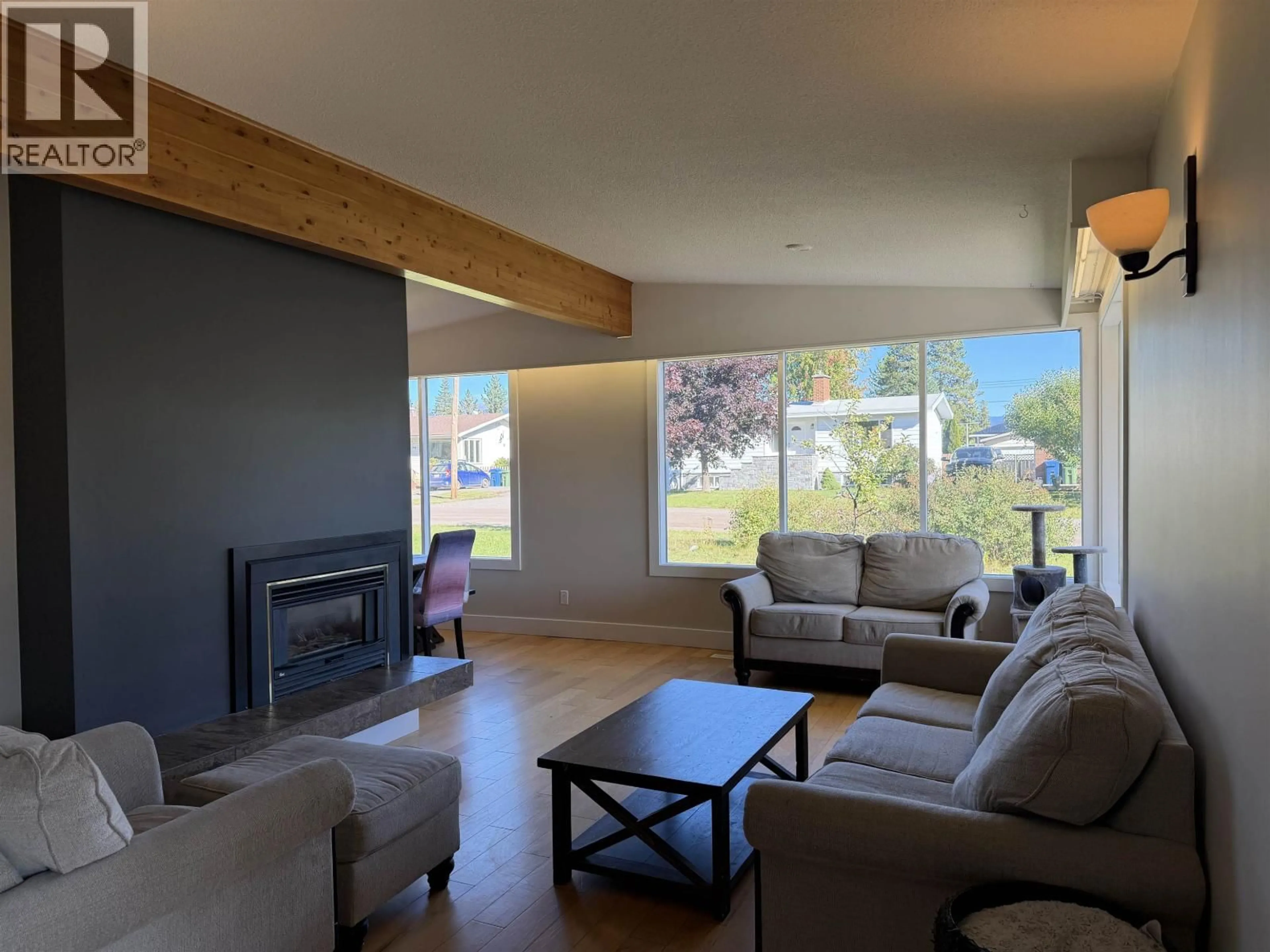 Living room with furniture, wood/laminate floor for 1637 QUEEN STREET, Smithers British Columbia V0J2N0