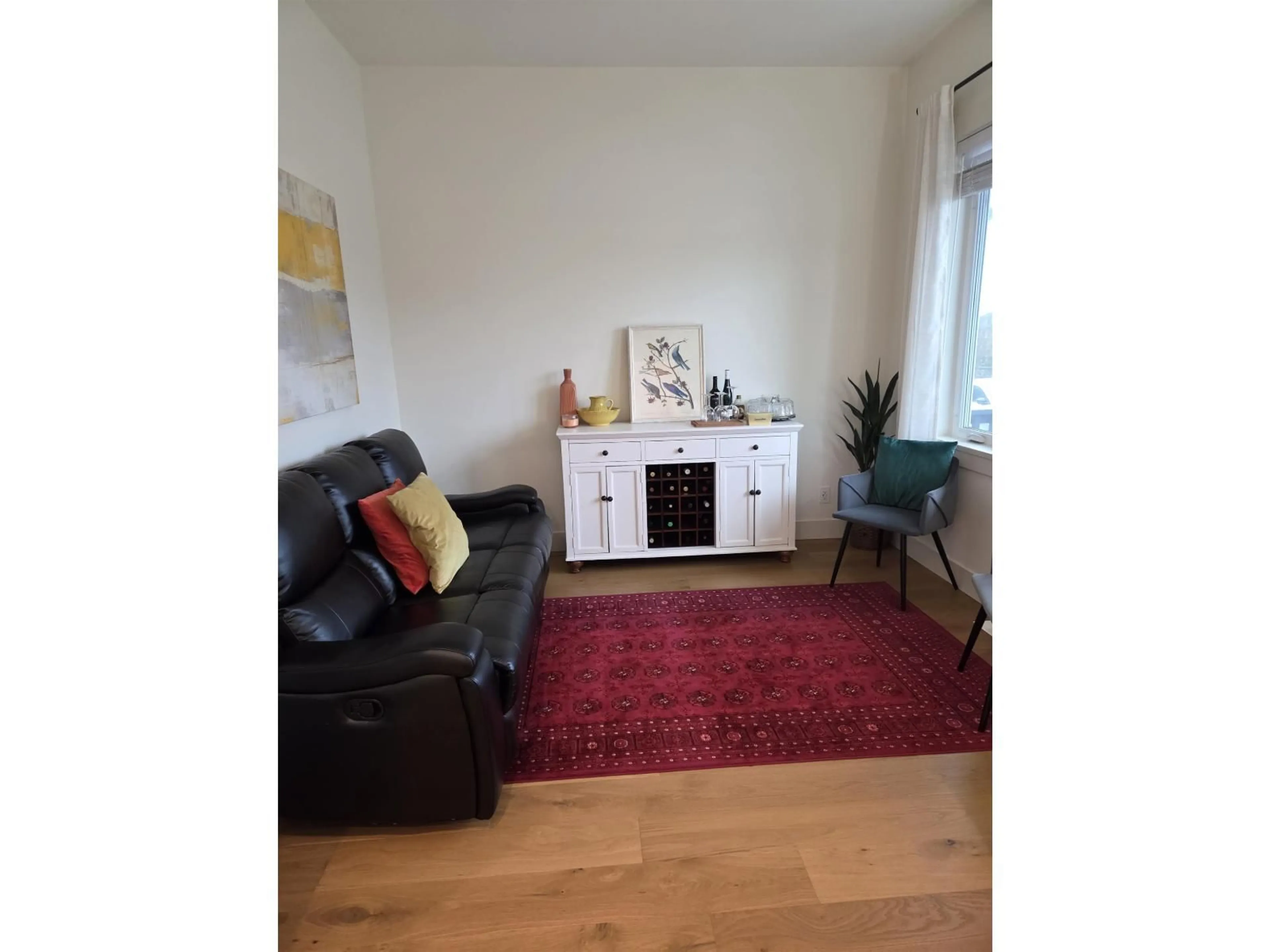 Living room with furniture, wood/laminate floor for 7477 197 STREET, Langley British Columbia V2Y3R6