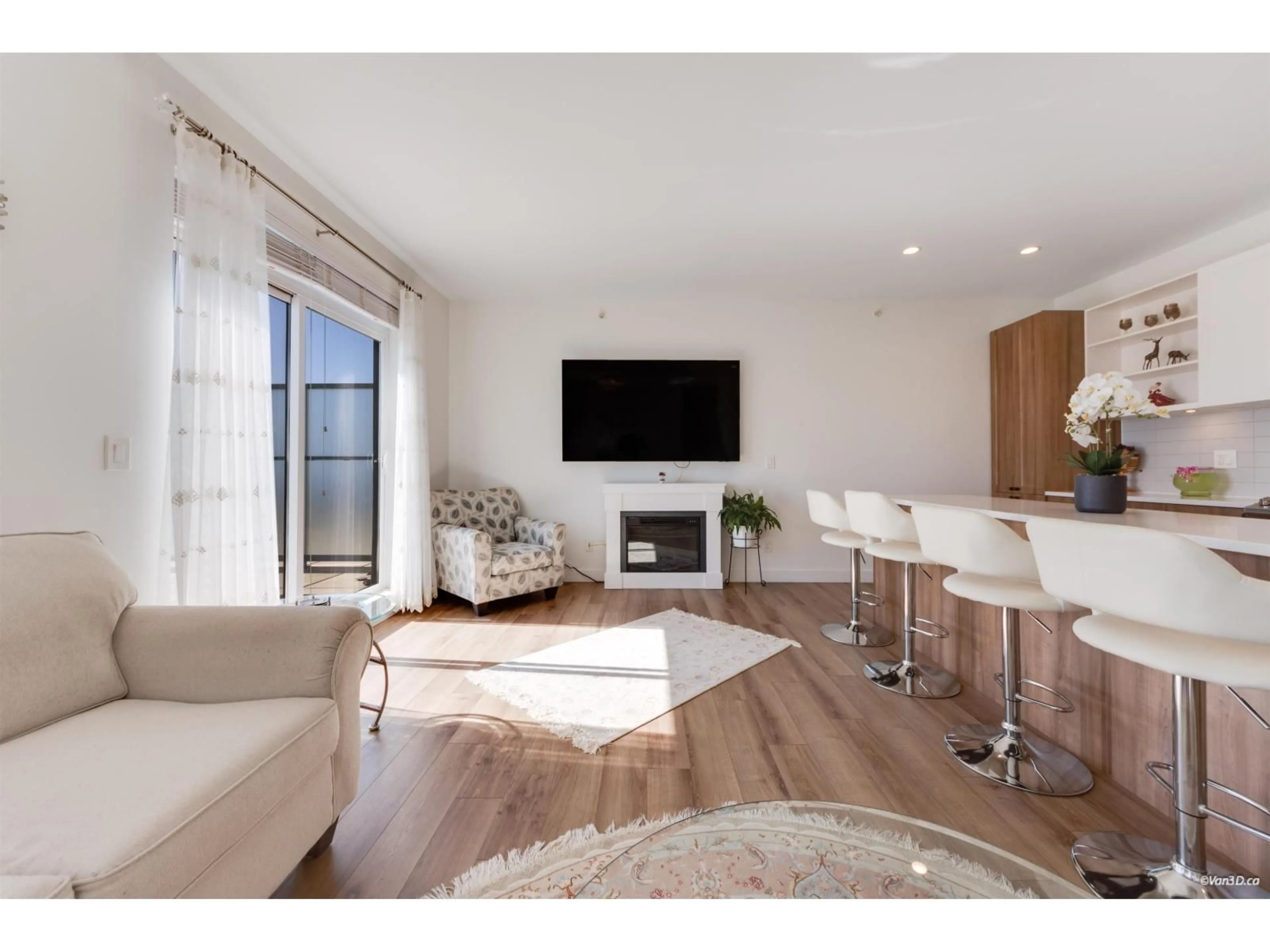 Living room with furniture, wood/laminate floor for A502 - 20487 65 AVENUE, Langley British Columbia V2Y3K5