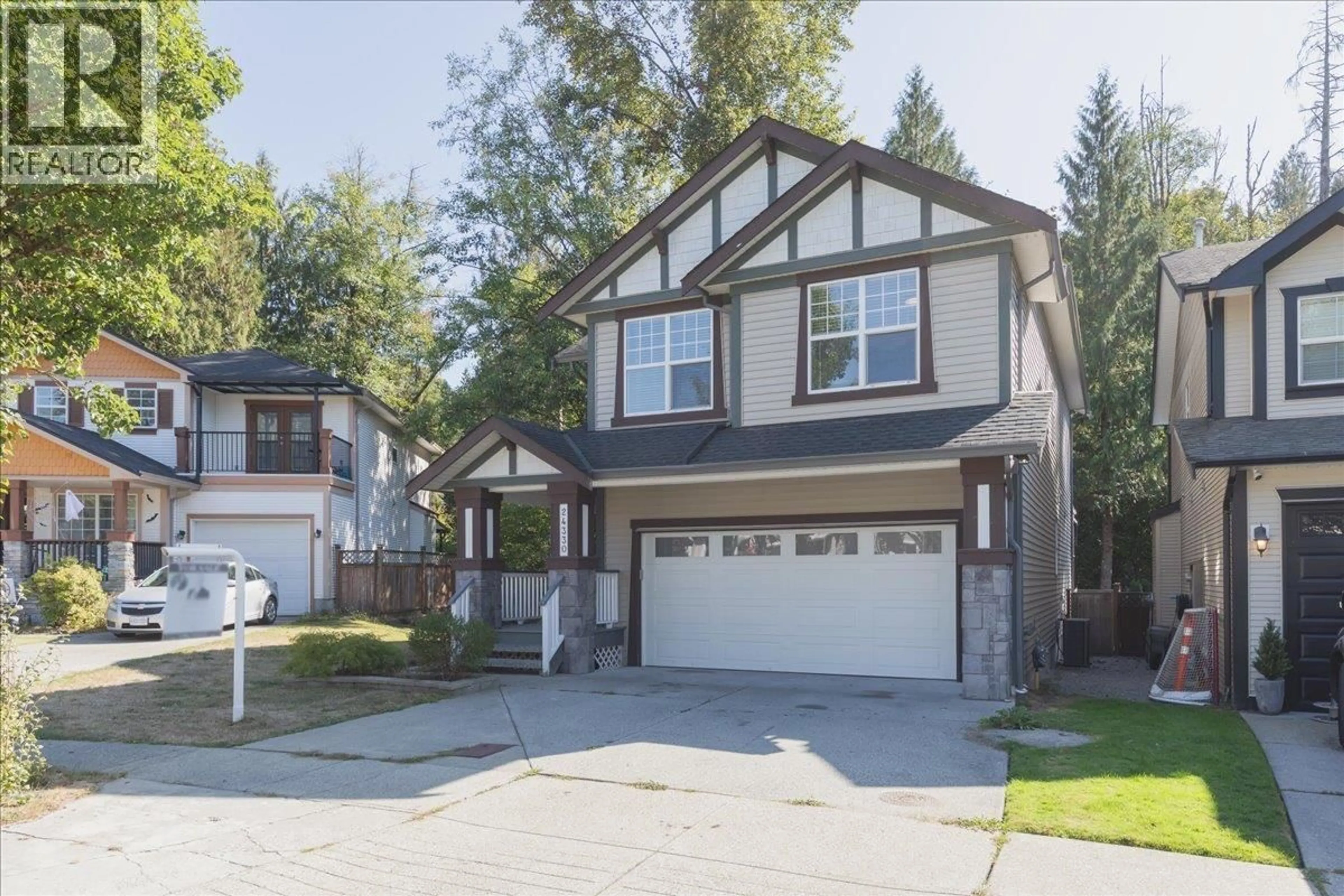 Home with vinyl exterior material, street for 24330 100B AVENUE, Maple Ridge British Columbia V2W1X3