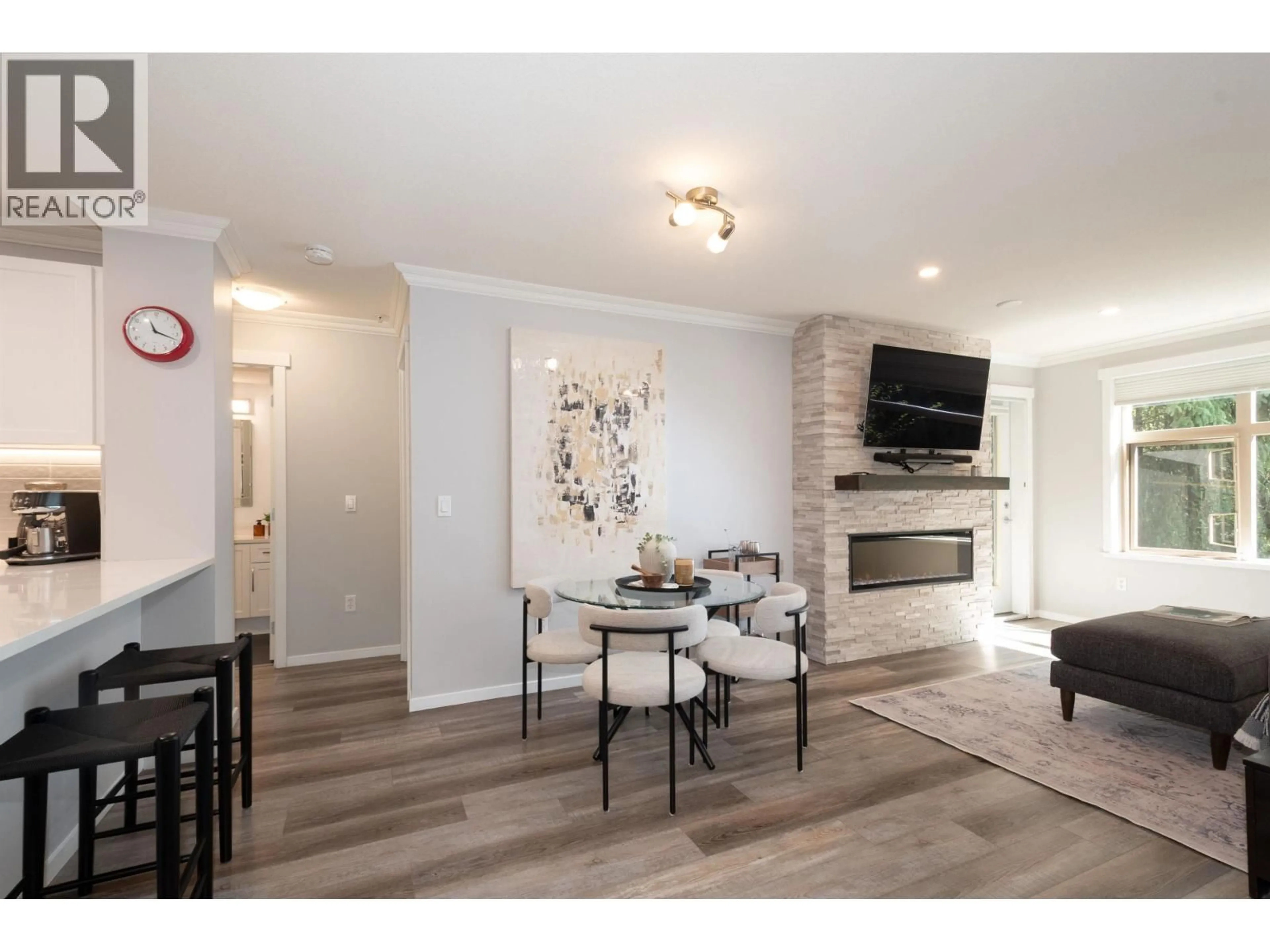 Living room with furniture, wood/laminate floor for 204 - 300 KLAHANIE DRIVE, Port Moody British Columbia V3H5K9