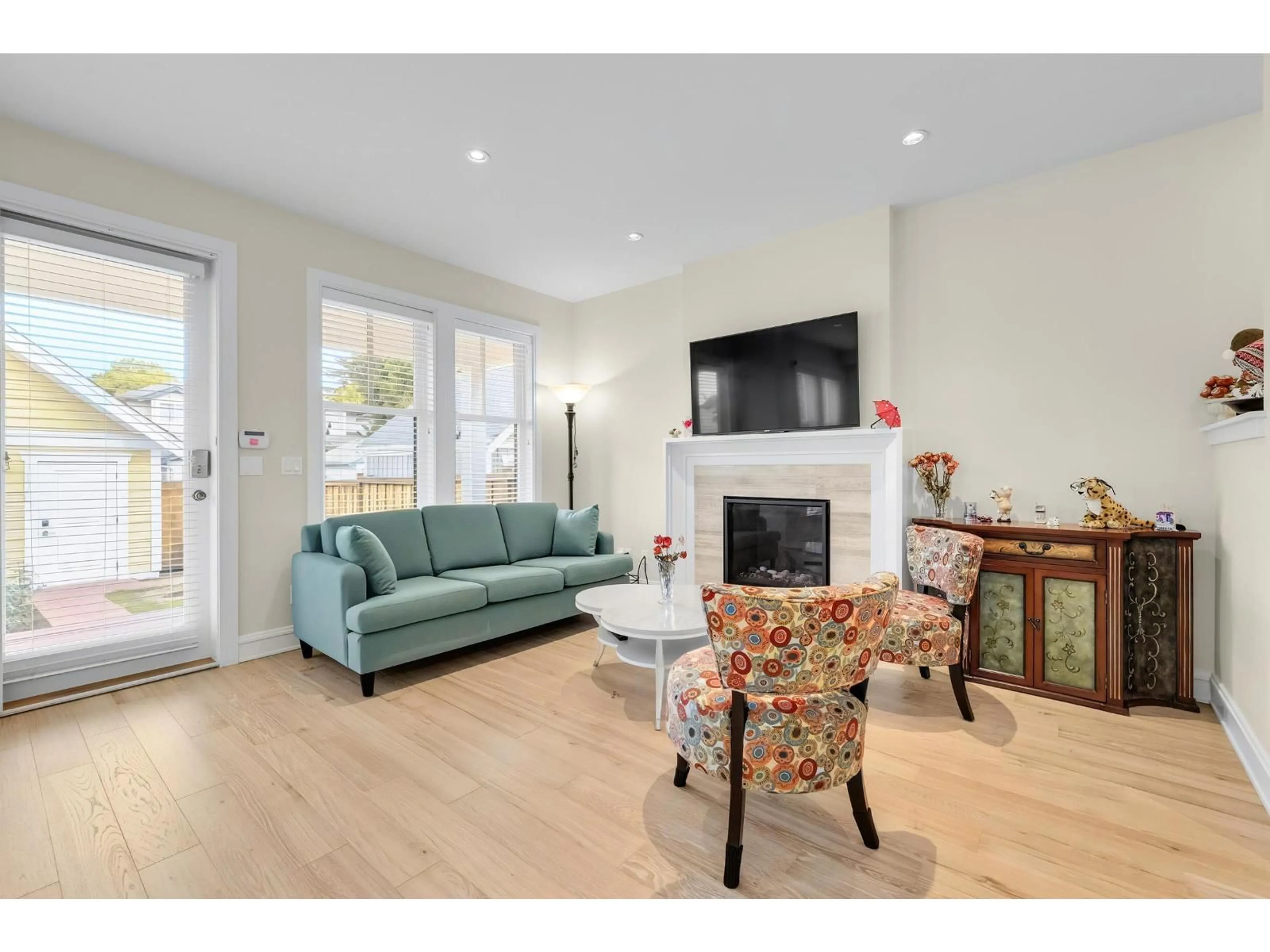 Living room with furniture, wood/laminate floor for 12955 15A AVENUE, Surrey British Columbia V4A0B7