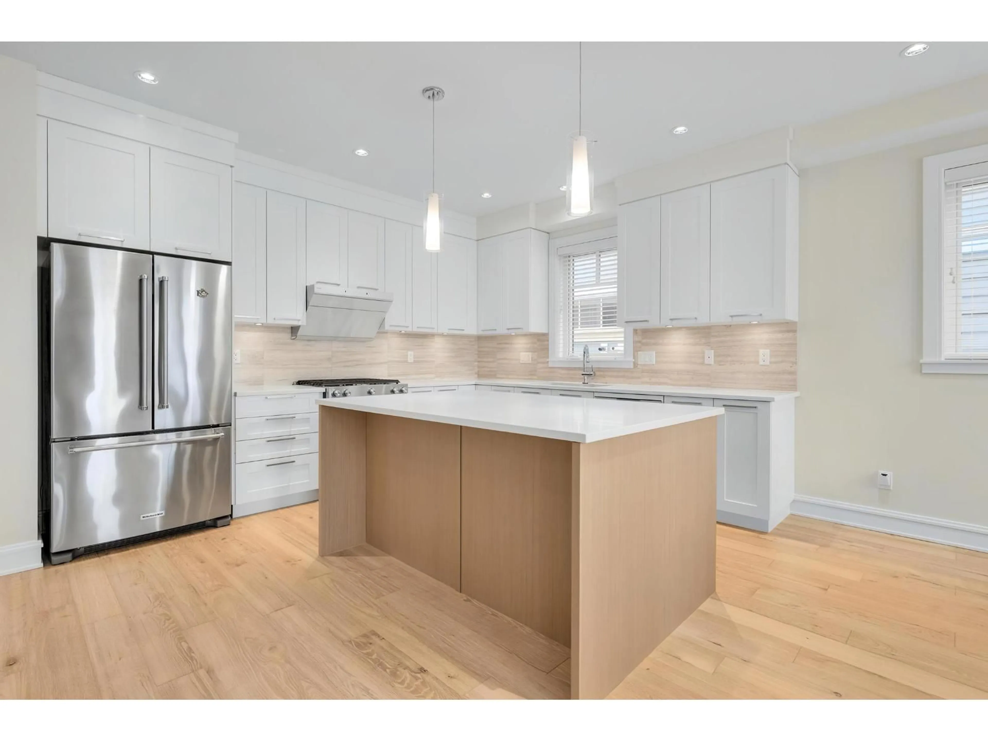 Open concept kitchen, wood/laminate floor for 12955 15A AVENUE, Surrey British Columbia V4A0B7
