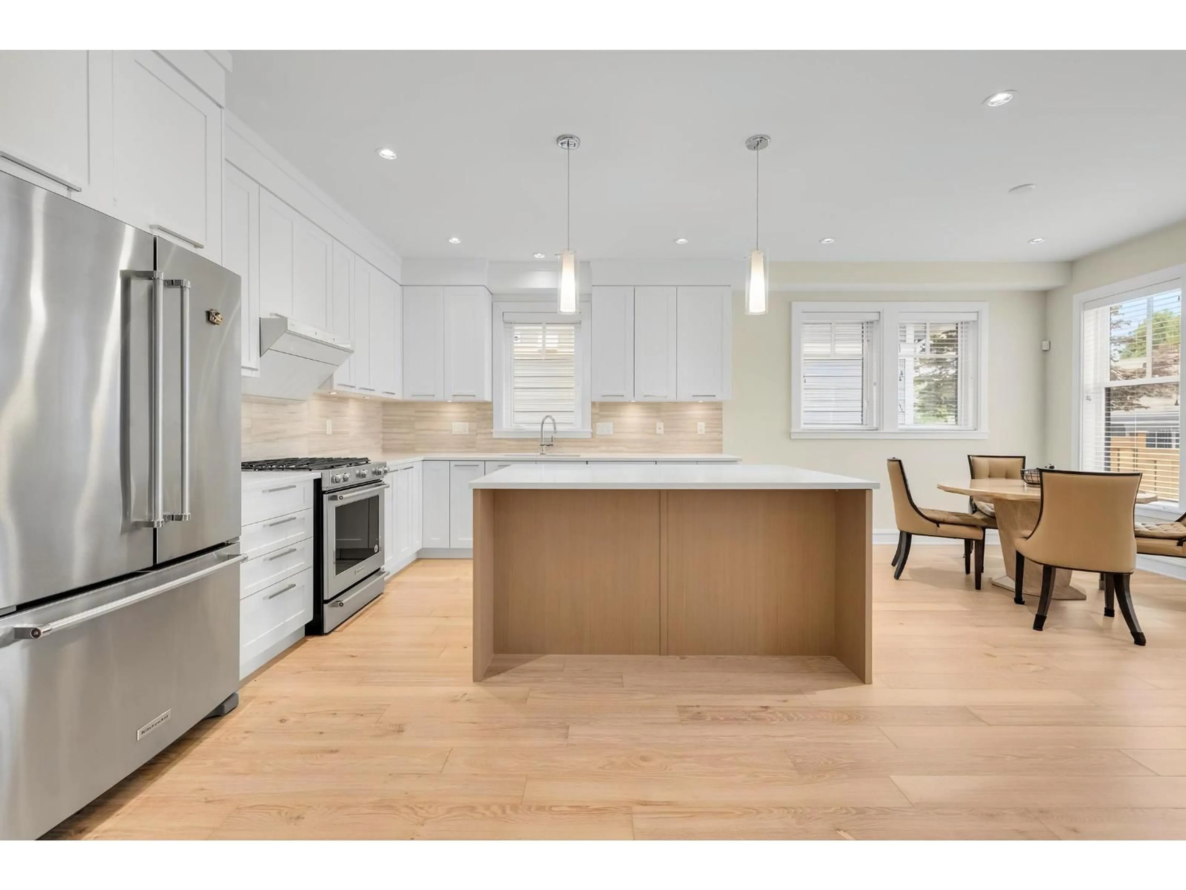Open concept kitchen, wood/laminate floor for 12955 15A AVENUE, Surrey British Columbia V4A0B7