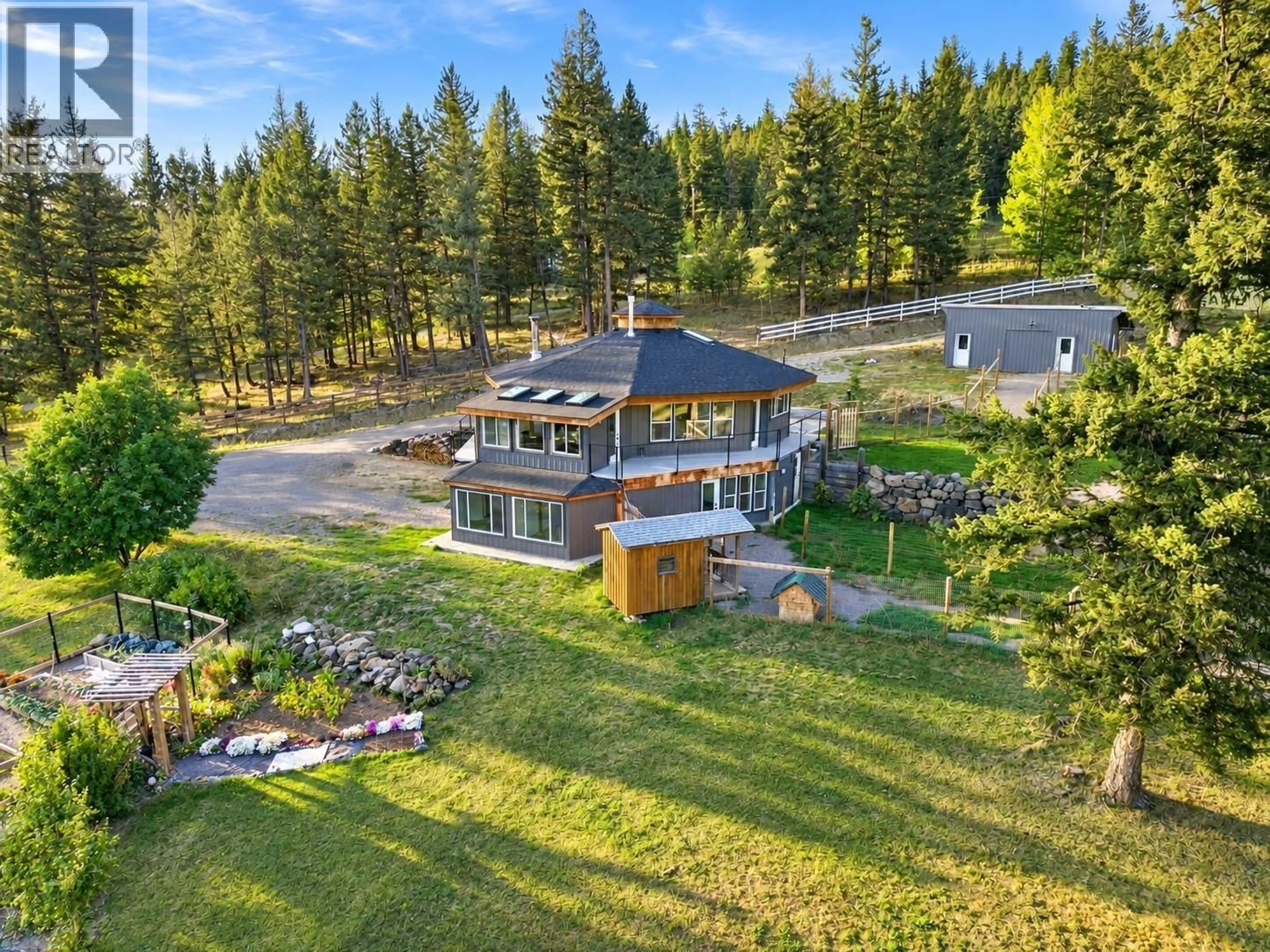 A pic from outside/outdoor area/front of a property/back of a property/a pic from drone, unknown for 6318 HIGHLAND CRESCENT, 100 Mile House British Columbia V0K2E3