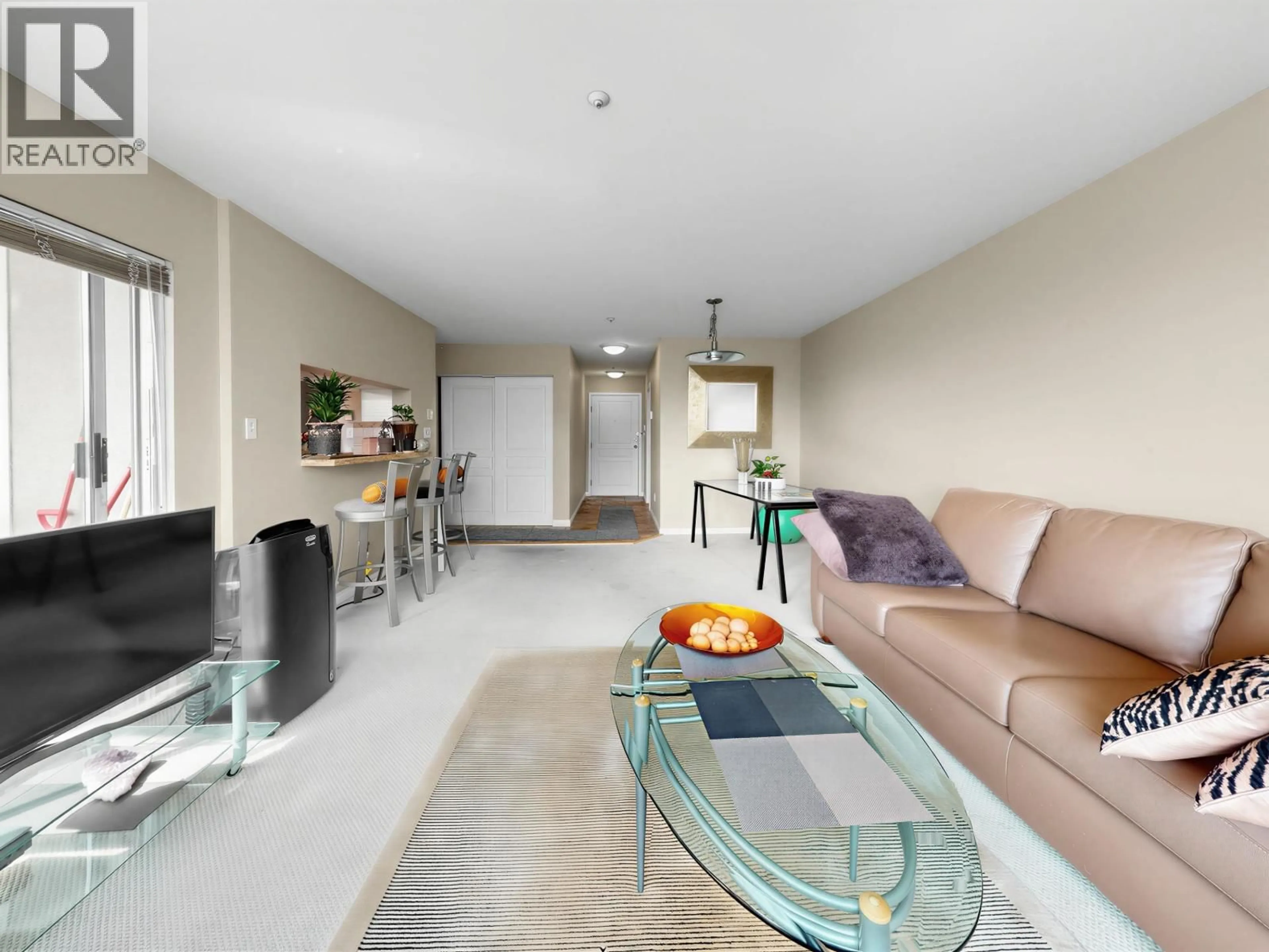 Living room with furniture, unknown for 312 - 8450 JELLICOE STREET, Vancouver British Columbia V5S4S9