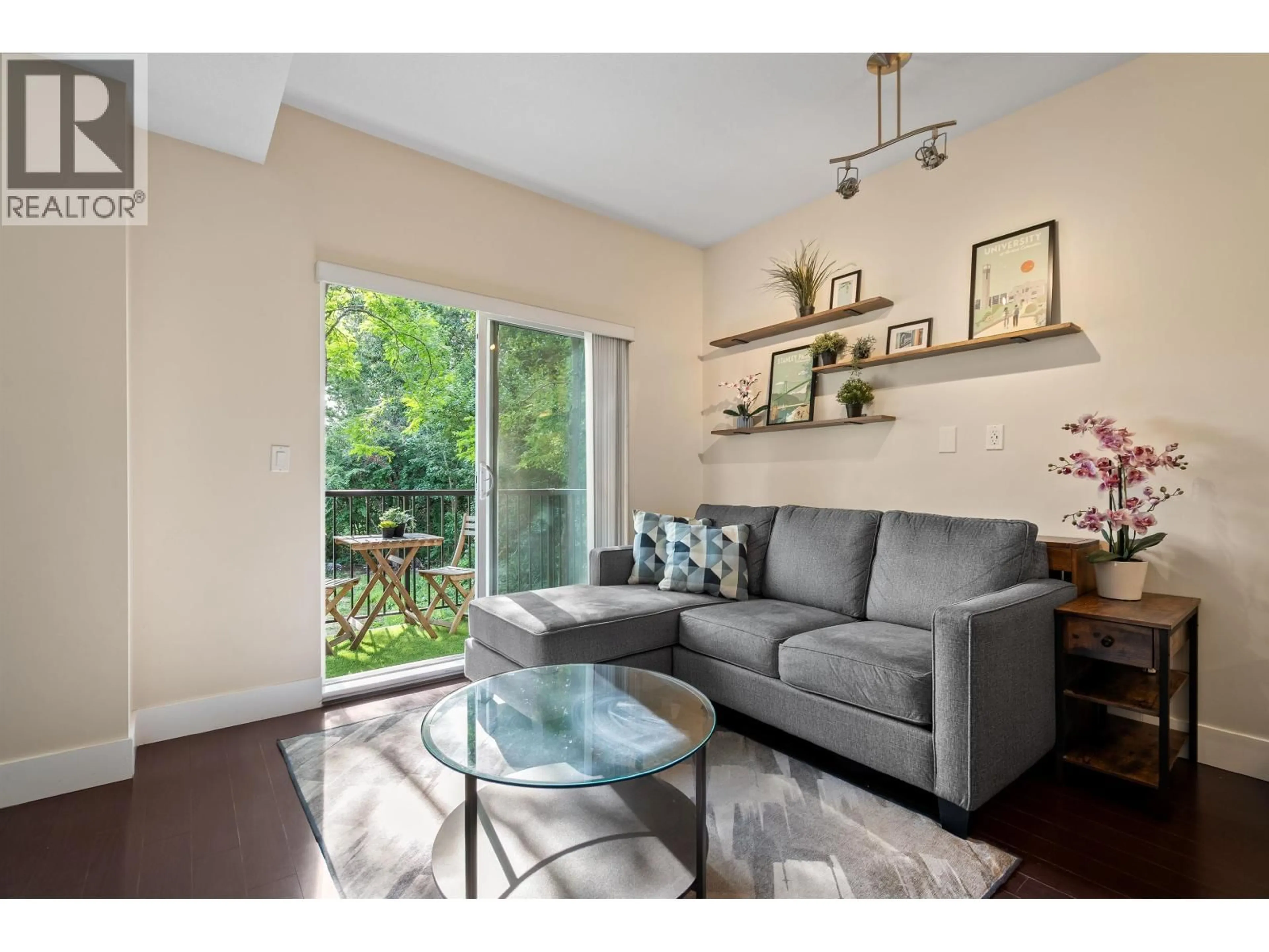 Living room with furniture, wood/laminate floor for 214 - 5211 IRMIN STREET, Burnaby British Columbia V5J0C9