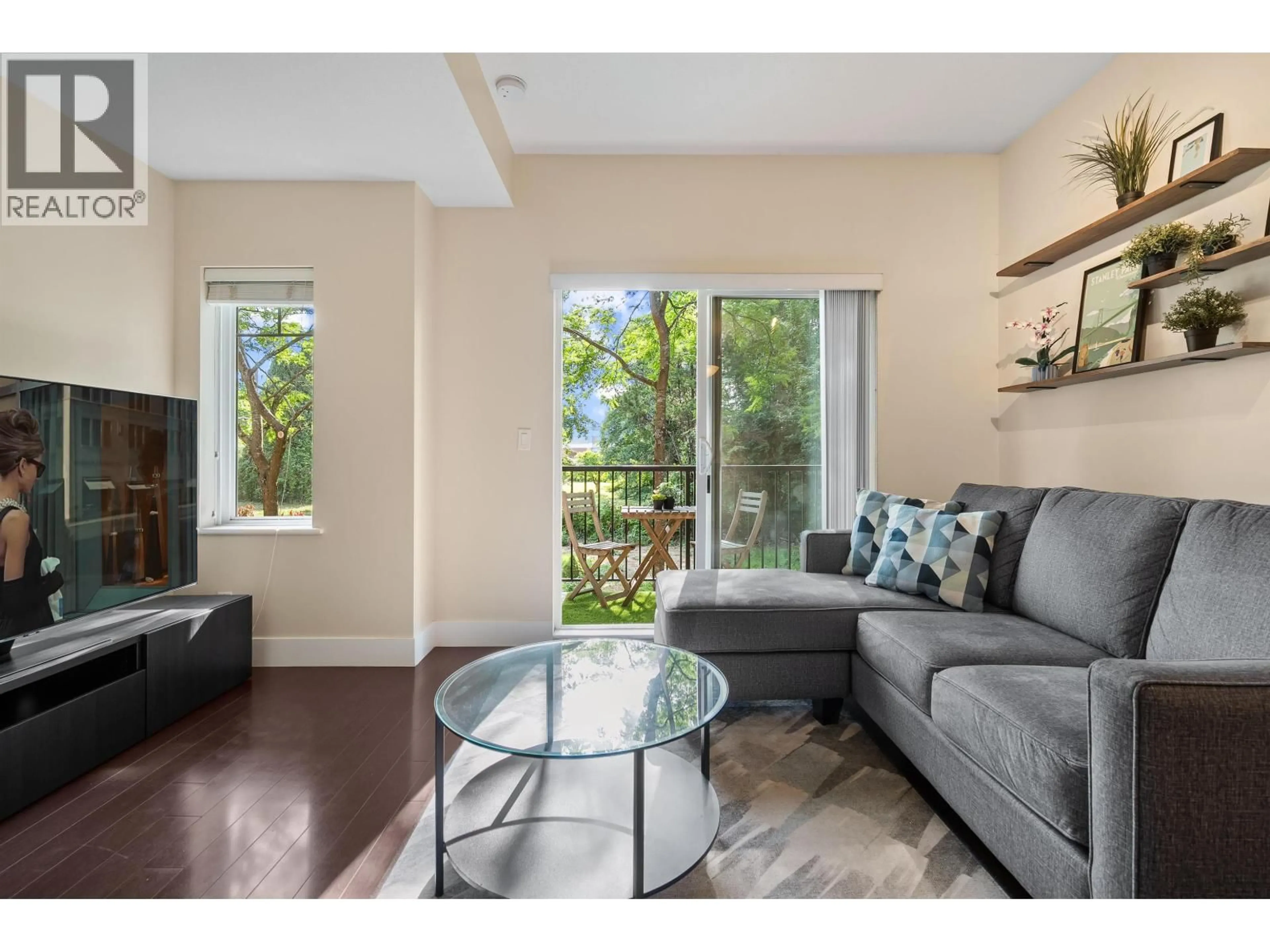 Living room with furniture, wood/laminate floor for 214 - 5211 IRMIN STREET, Burnaby British Columbia V5J0C9