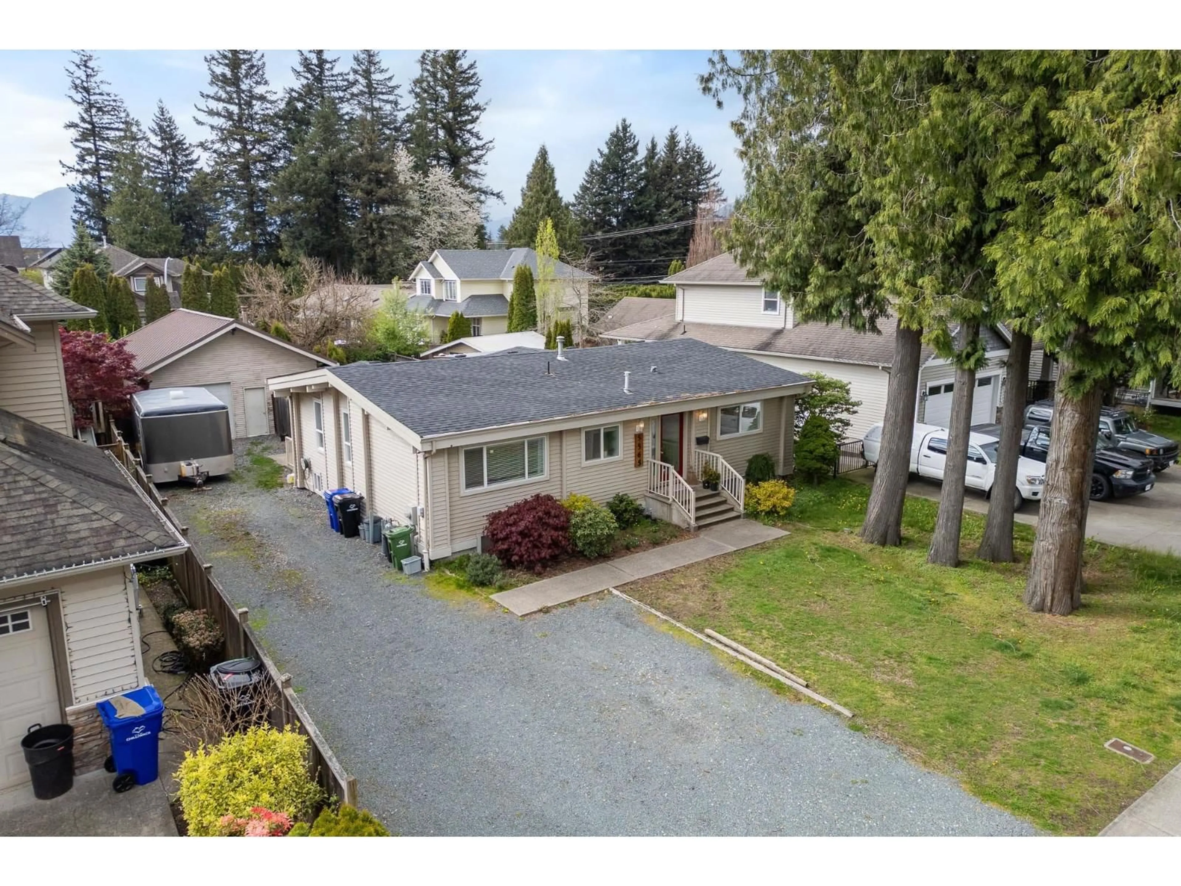 A pic from outside/outdoor area/front of a property/back of a property/a pic from drone, street for 5565 PEACH ROAD, Chilliwack British Columbia V2R5L9