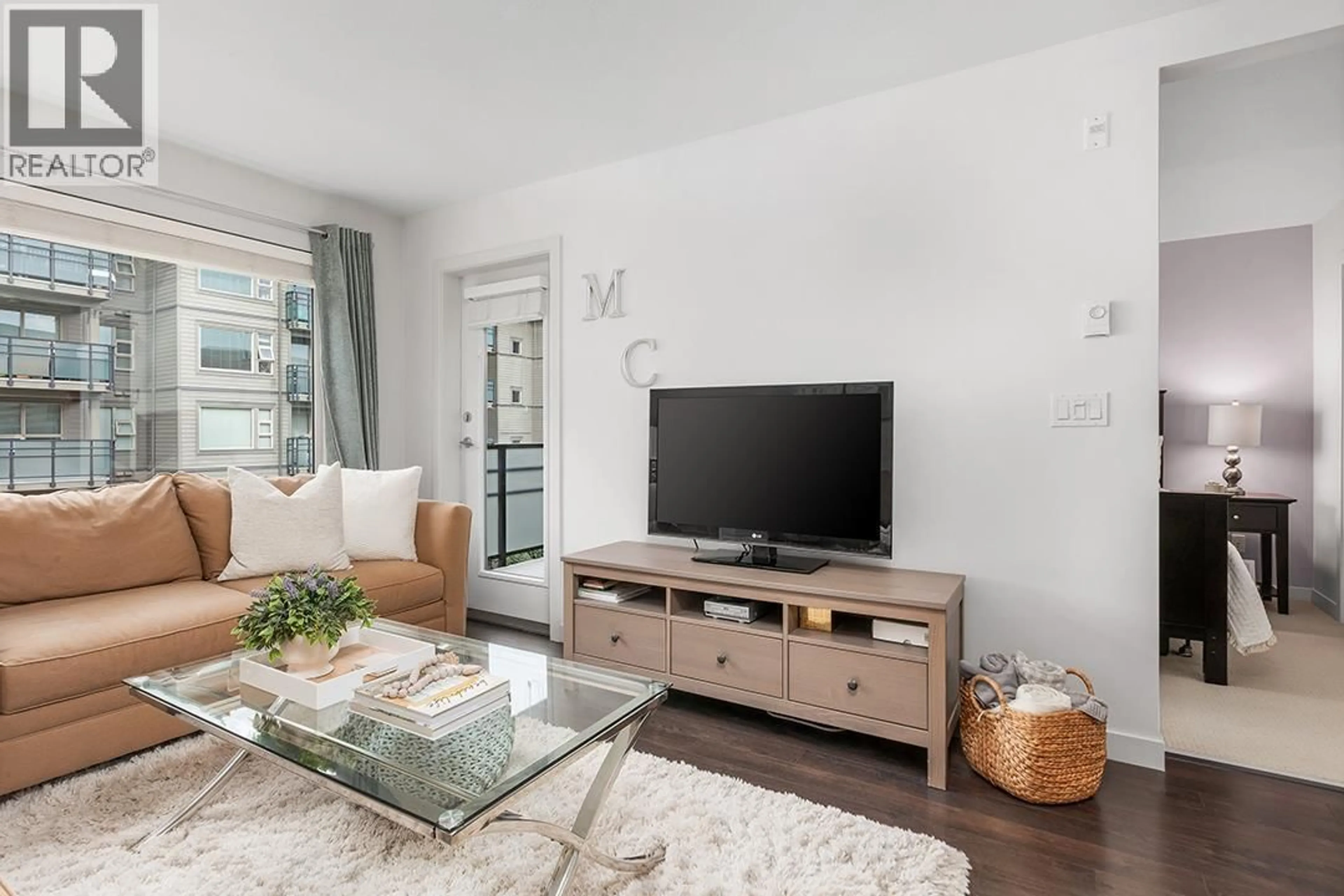 Living room with furniture, unknown for 301 - 1673 LLOYD AVENUE, North Vancouver British Columbia V7P0A9