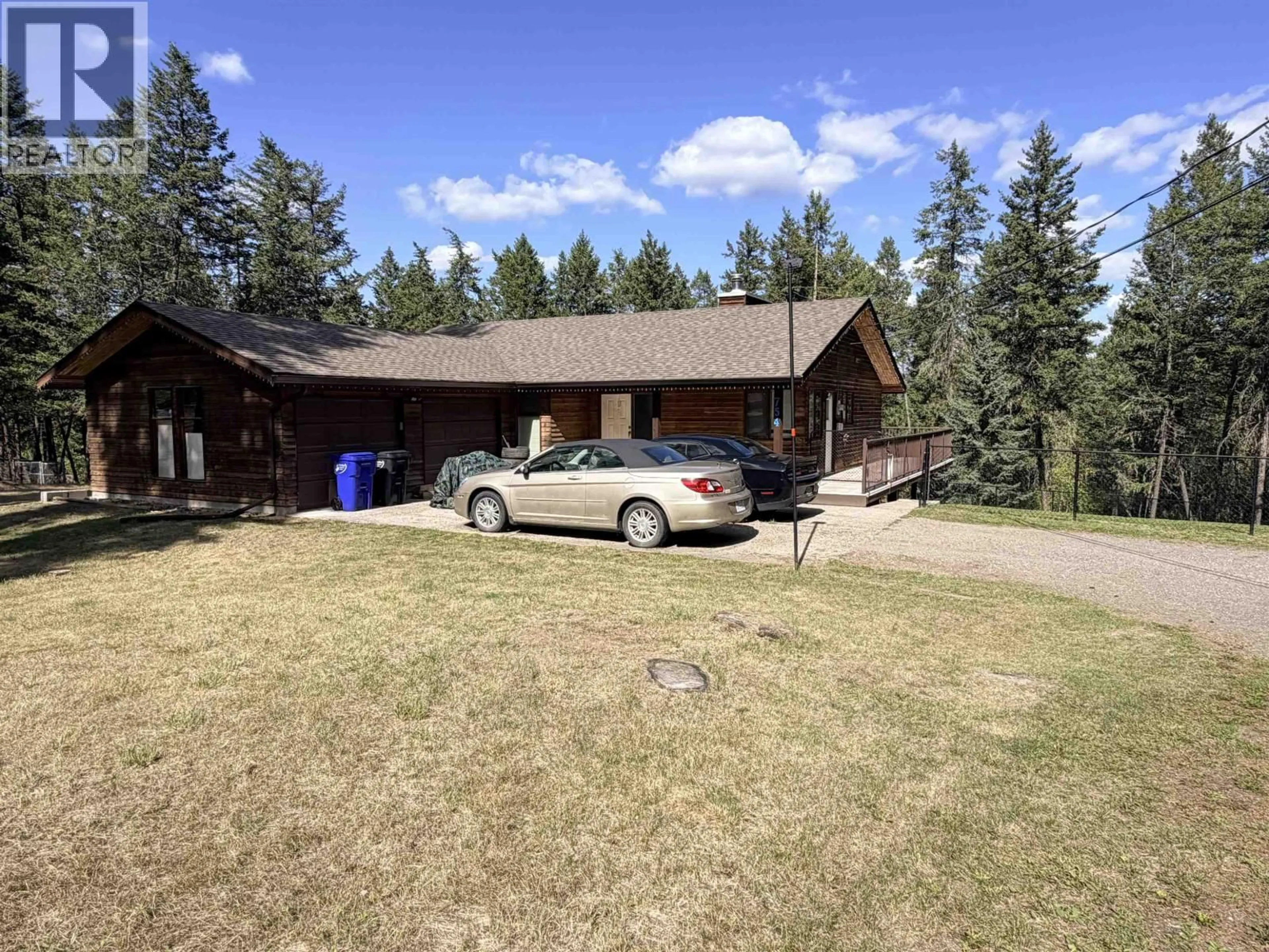 A pic from outside/outdoor area/front of a property/back of a property/a pic from drone, mountain view for 754 ROBERTS DRIVE, Williams Lake British Columbia V2G5K1
