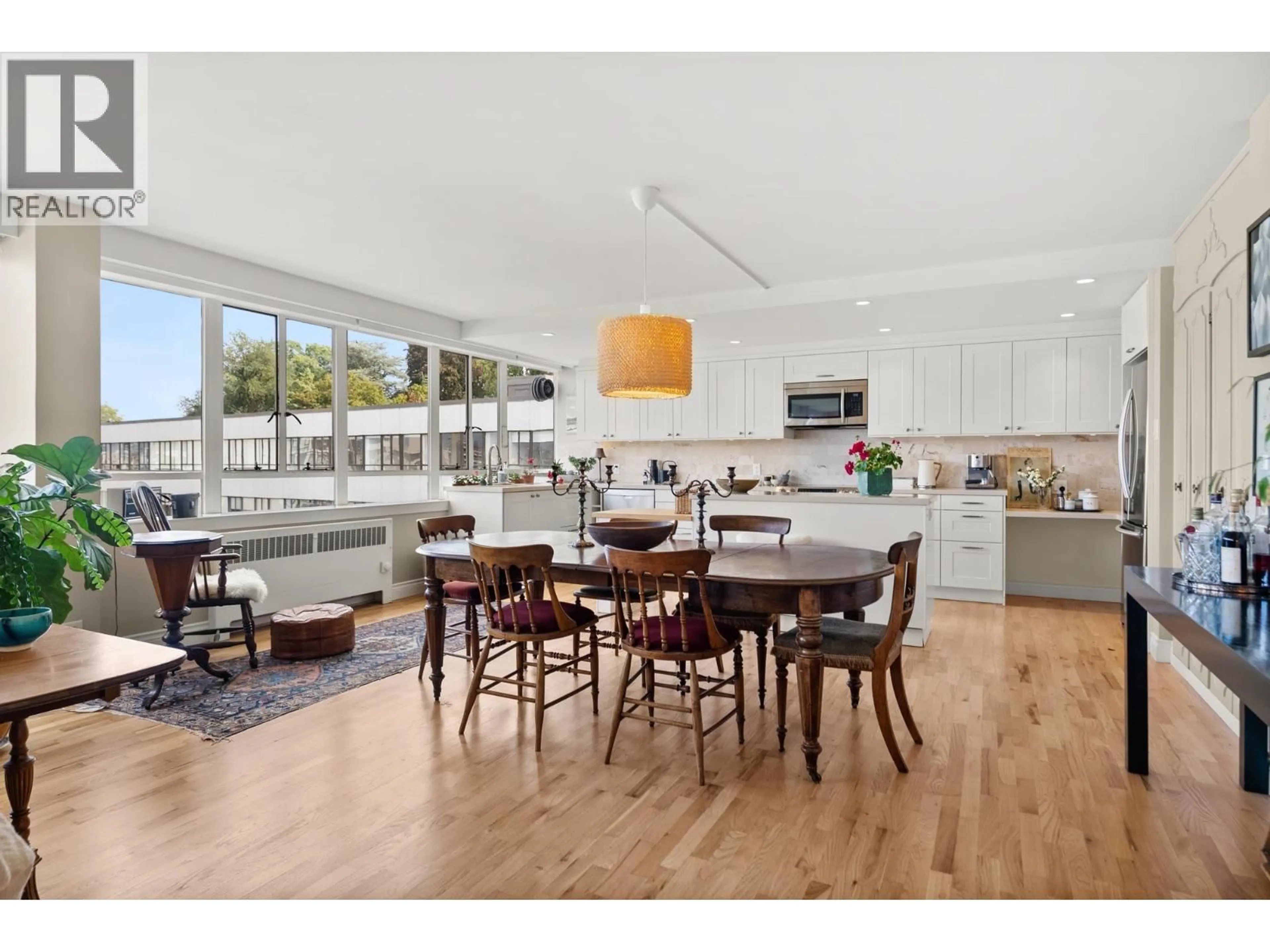 Open concept kitchen, wood/laminate floor for 825 - 1445 MARPOLE AVENUE, Vancouver British Columbia V6H1S5