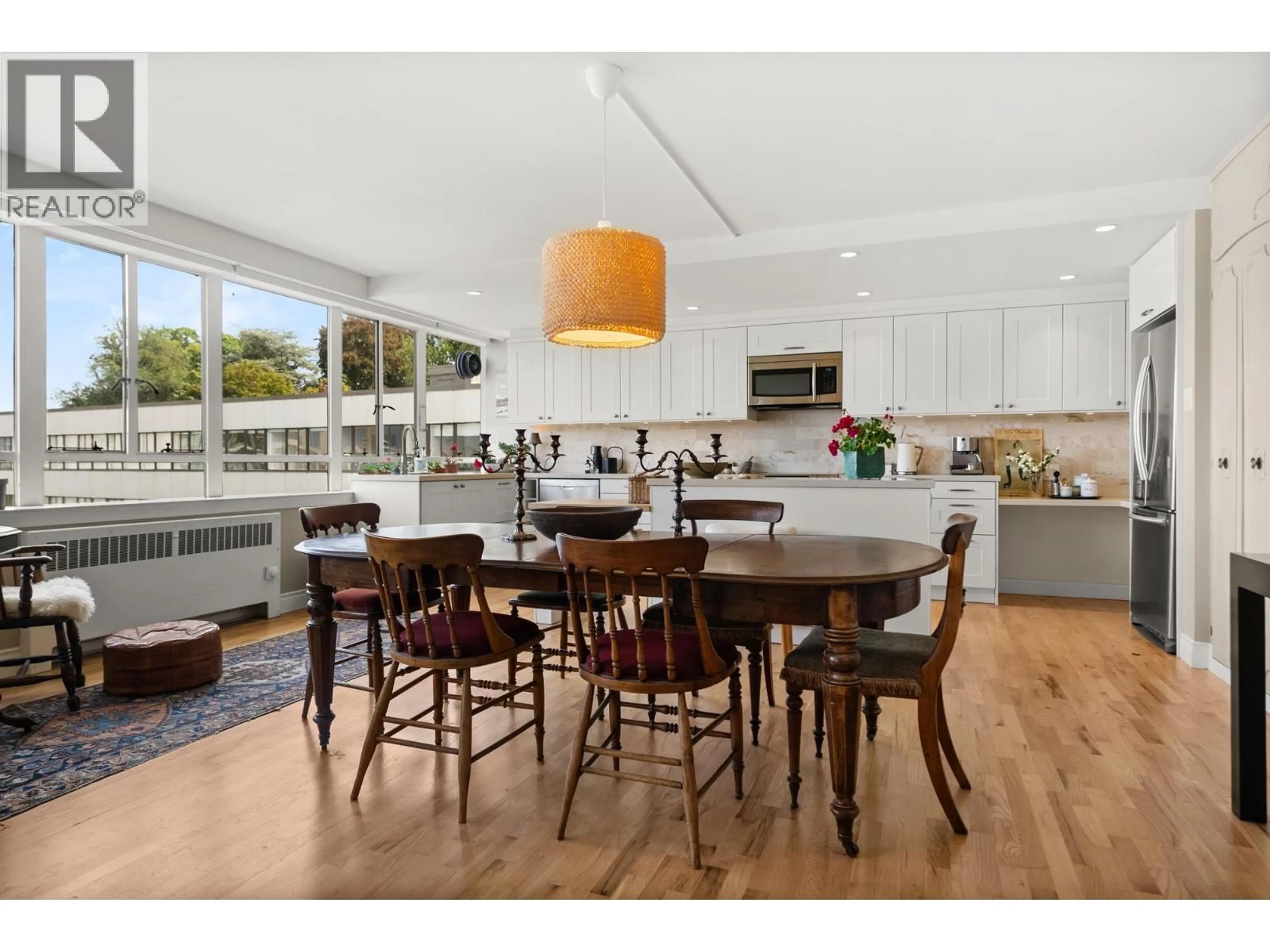 Open concept kitchen, wood/laminate floor for 825 - 1445 MARPOLE AVENUE, Vancouver British Columbia V6H1S5