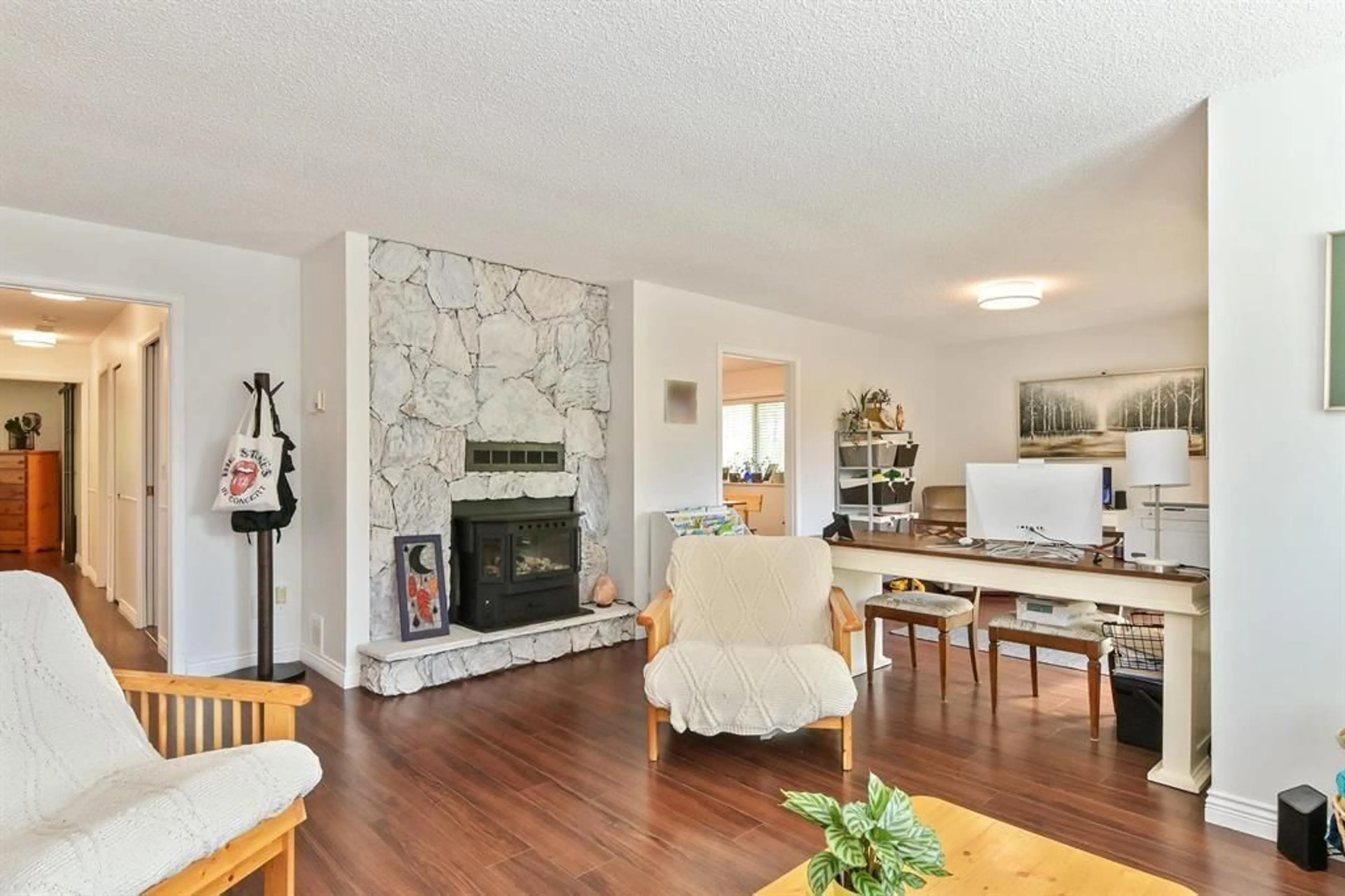 Living room with furniture, wood/laminate floor for 19919 51 AVENUE, Langley British Columbia V3A7P2
