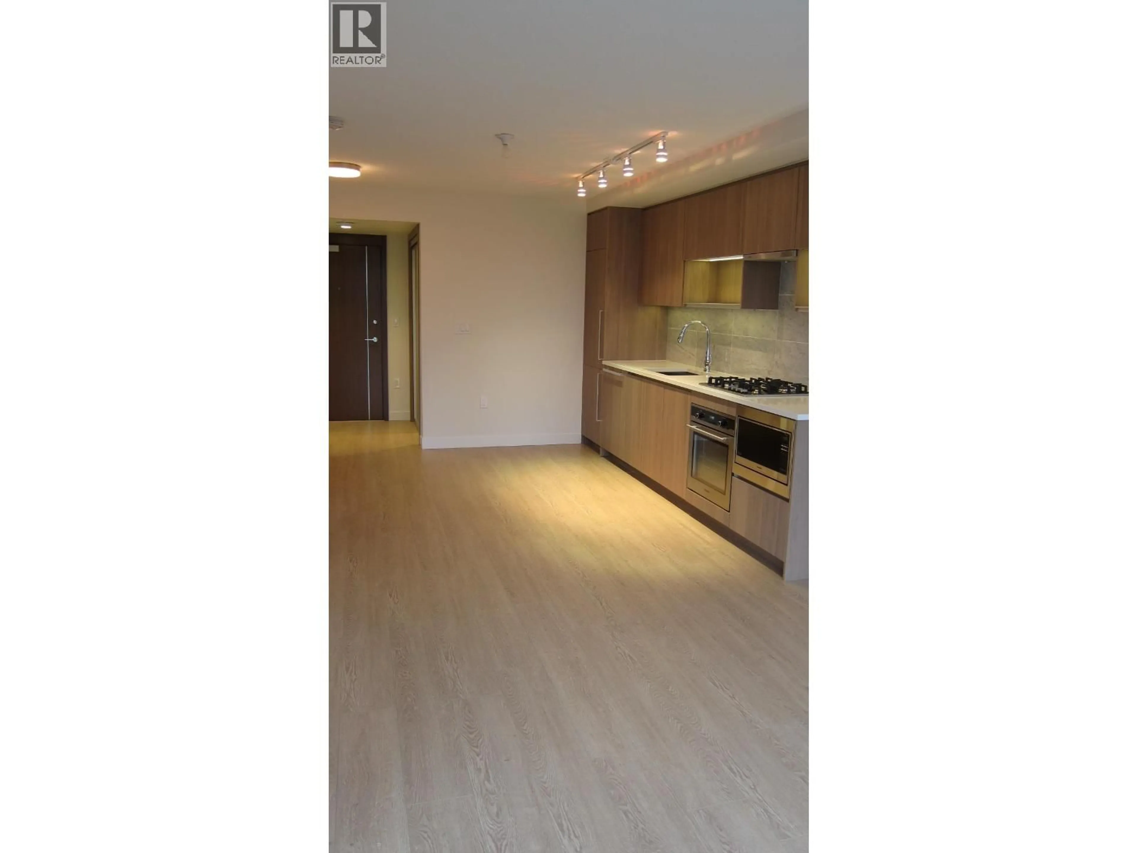 Open concept kitchen, wood/laminate floor for 611 - 8988 PATTERSON ROAD, Richmond British Columbia V6X0R2