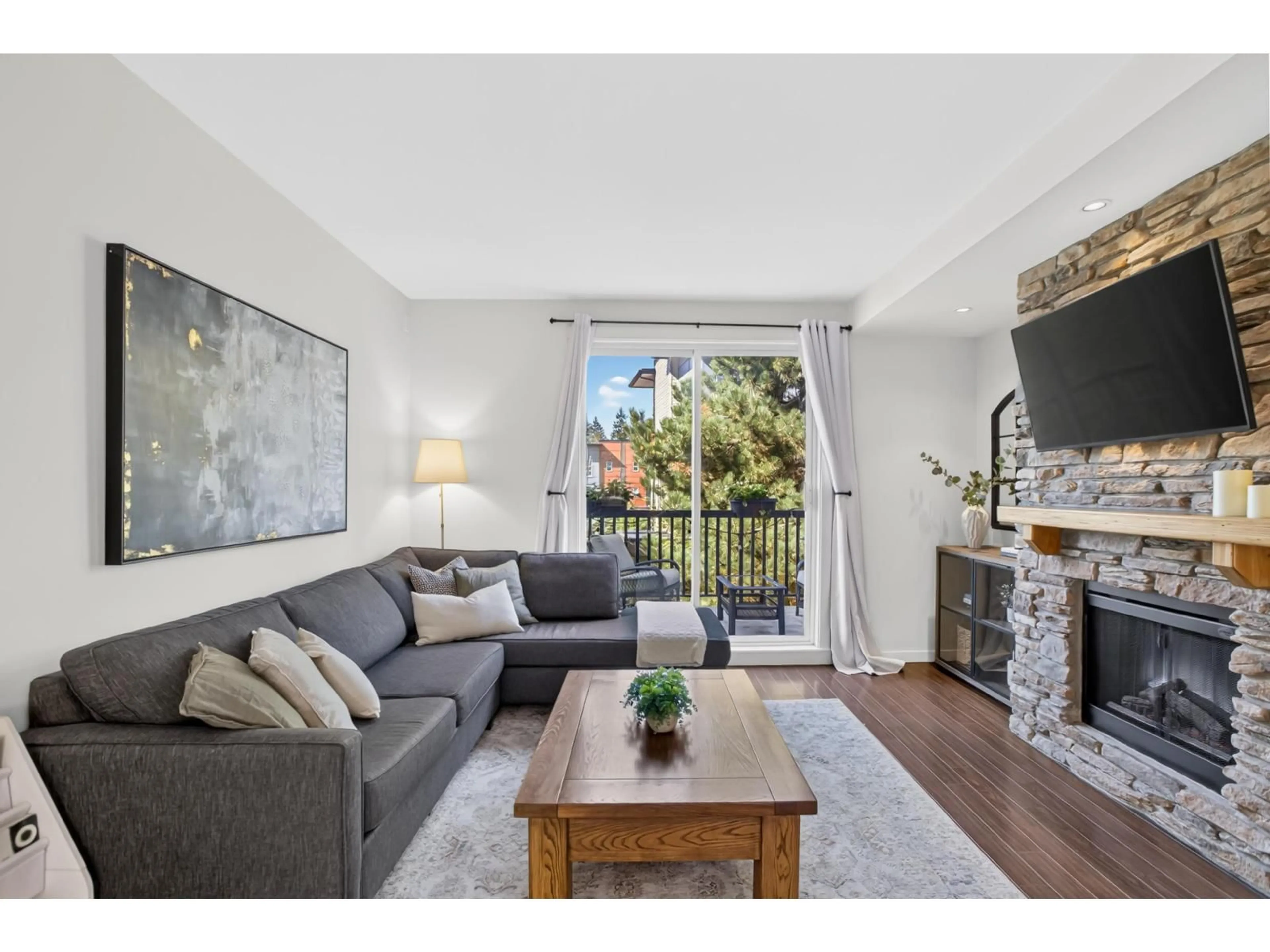 Living room with furniture, wood/laminate floor for 82 - 18983 72A AVENUE, Surrey British Columbia V4N1A5