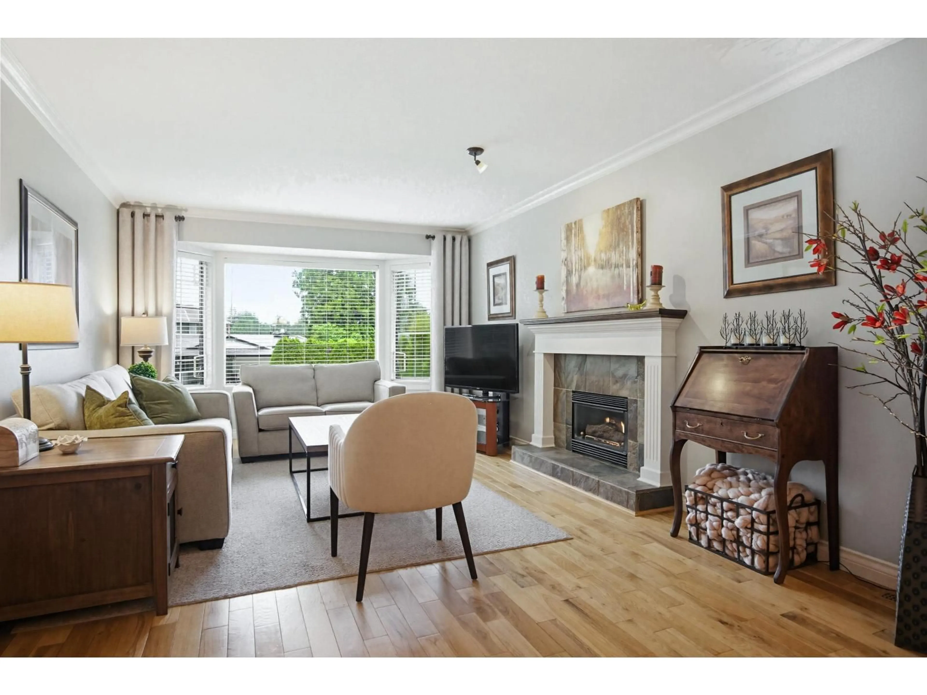 Living room with furniture, wood/laminate floor for 20474 43A AVENUE, Langley British Columbia V3A3C8