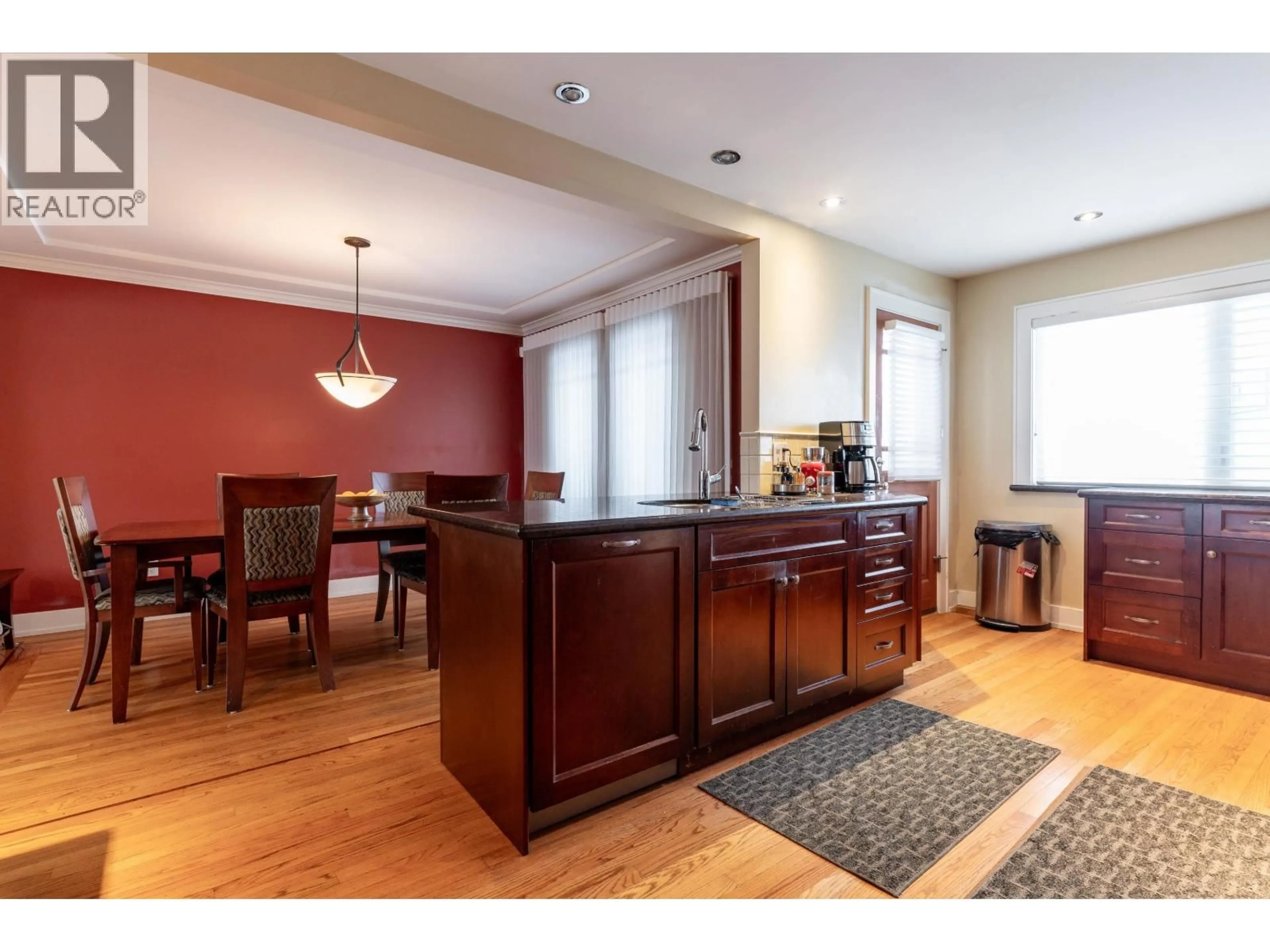 Open concept kitchen, wood/laminate floor for 5570 BAILLIE STREET, Vancouver British Columbia V5Z3M8
