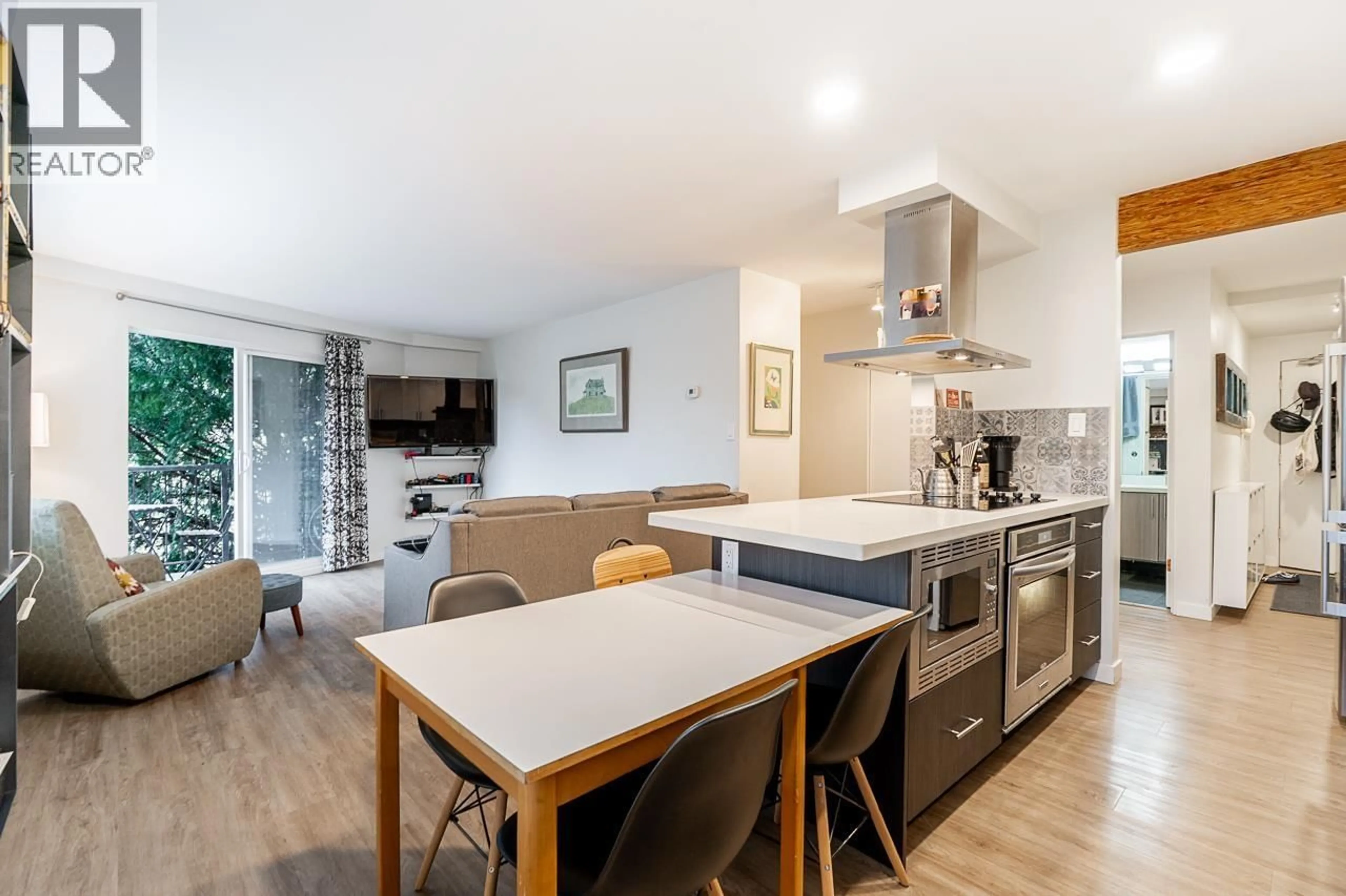 Open concept kitchen, wood/laminate floor for 213 - 36 14TH AVENUE, Vancouver British Columbia V5T4C9