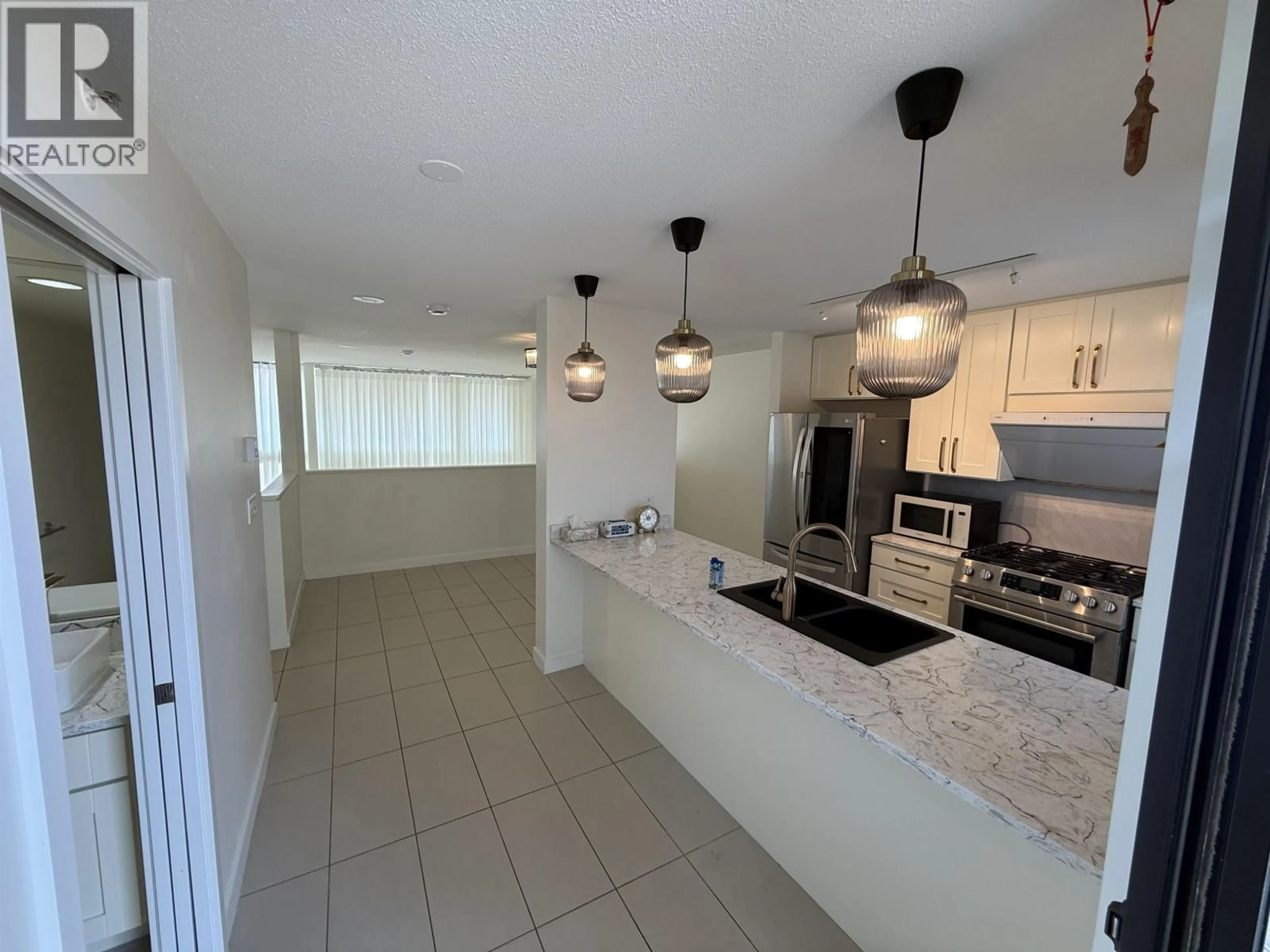 Open concept kitchen, ceramic/tile floor for 1 - 7911 ACKROYD ROAD, Richmond British Columbia V6X4L6