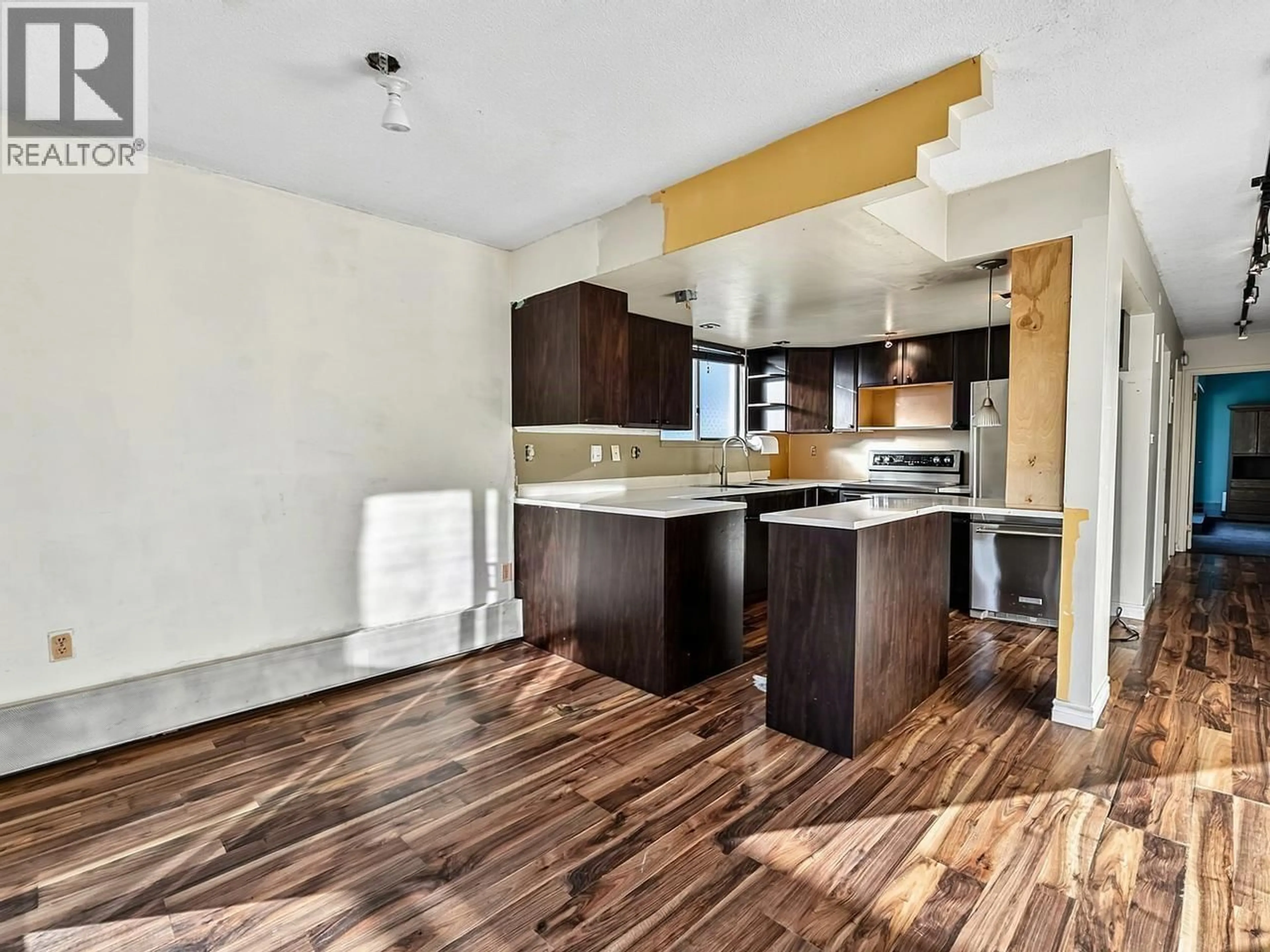 Open concept kitchen, wood/laminate floor for 701 - 1165 BURNABY STREET, Vancouver British Columbia V6E1P3