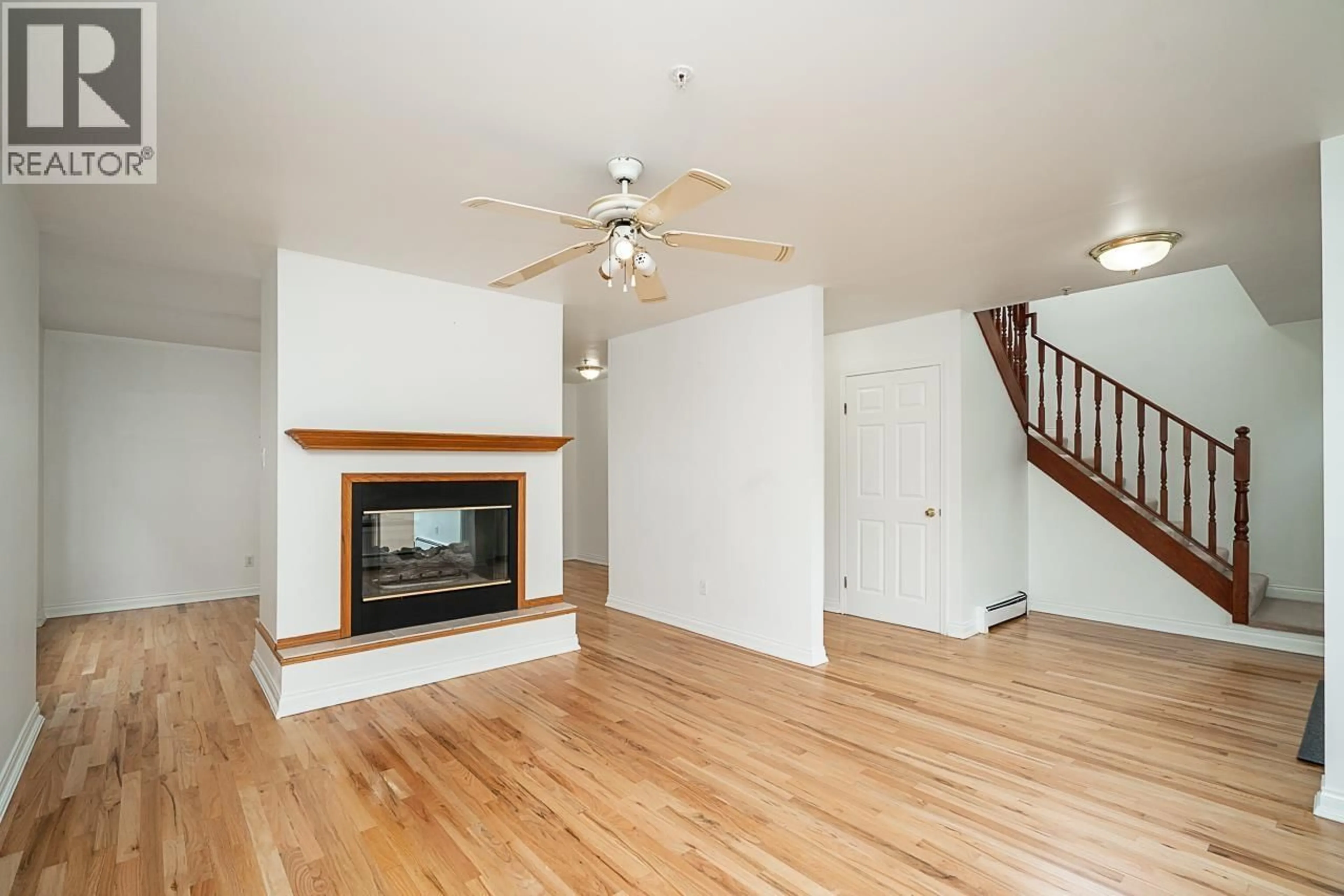 Living room with furniture, wood/laminate floor for 2948 GRANT STREET, Vancouver British Columbia V5K3E7